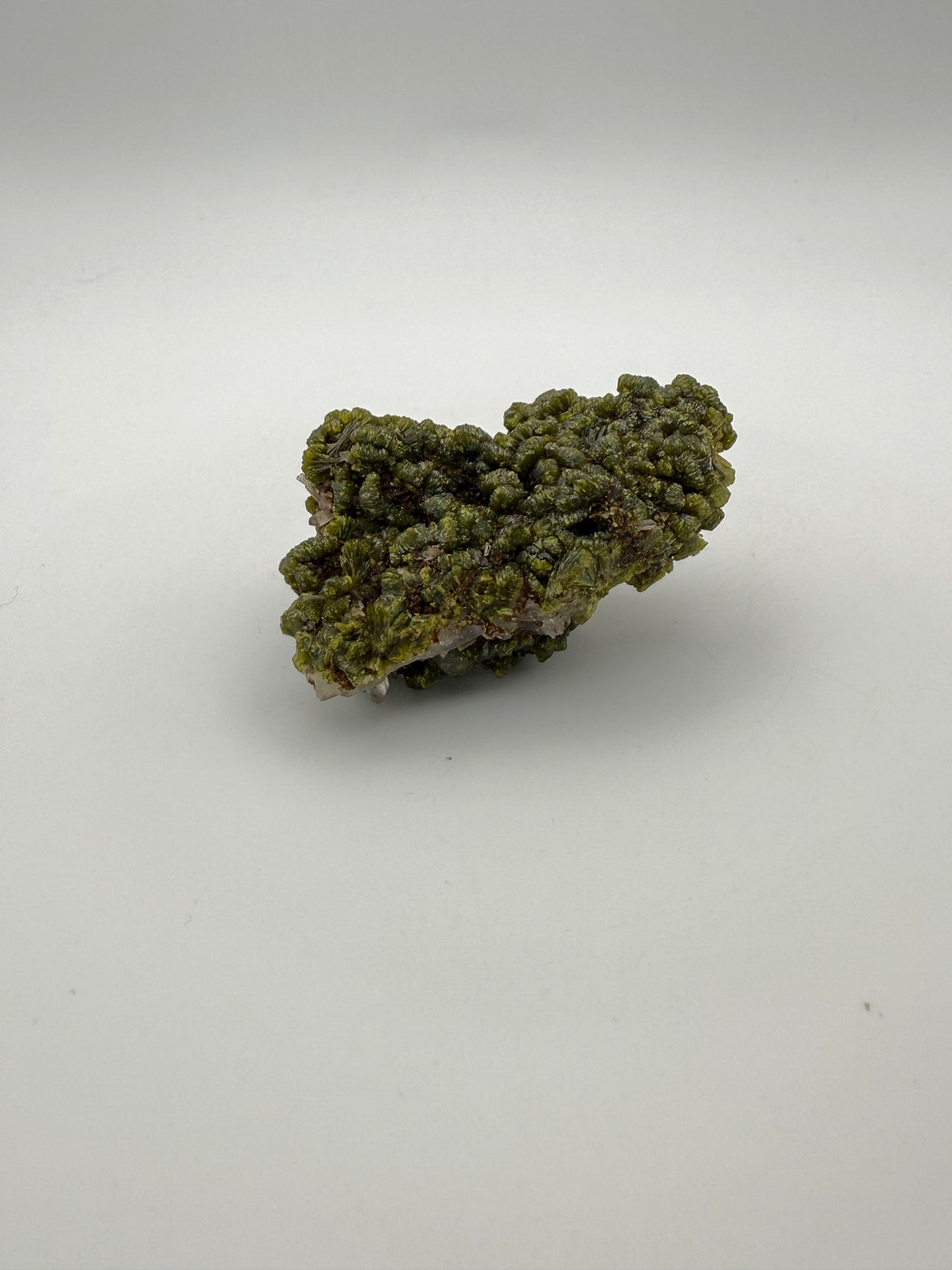 Epidote crystal cluster with good green color.