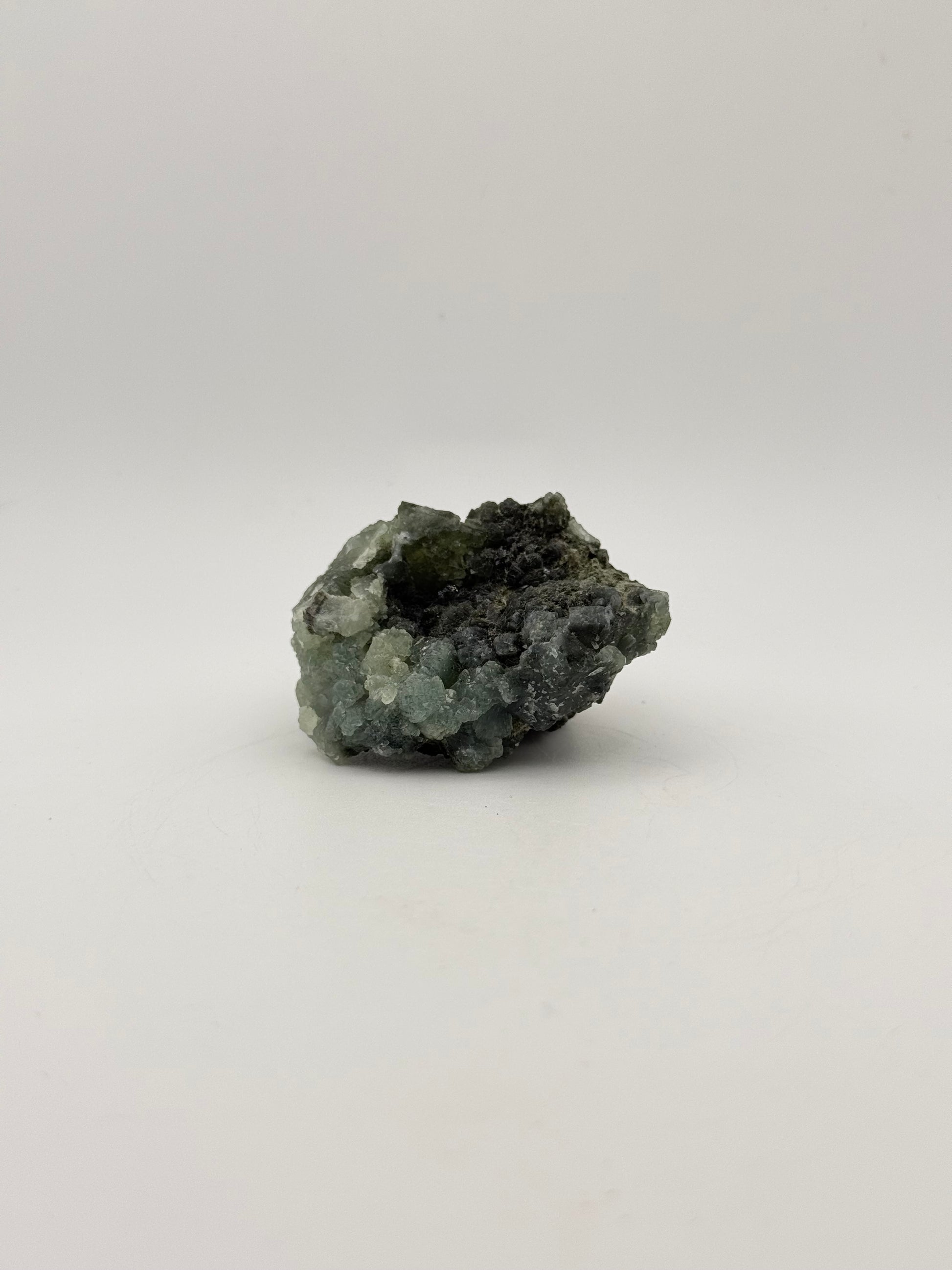 Raw Prehnite specimen with amazing green color.