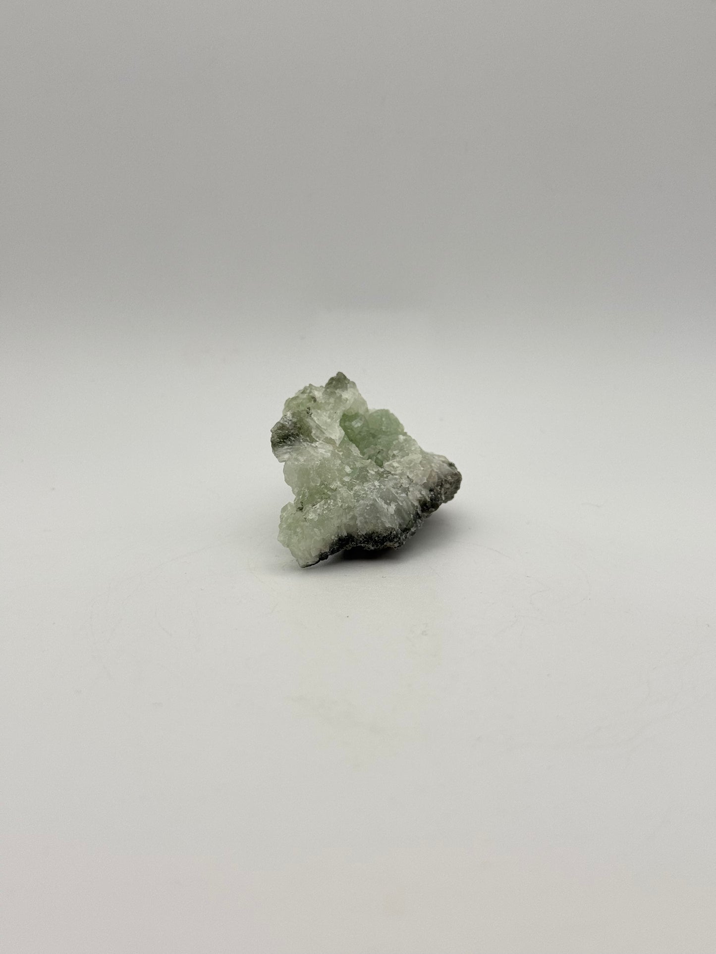 Raw prehnite specimen with amazing green color.