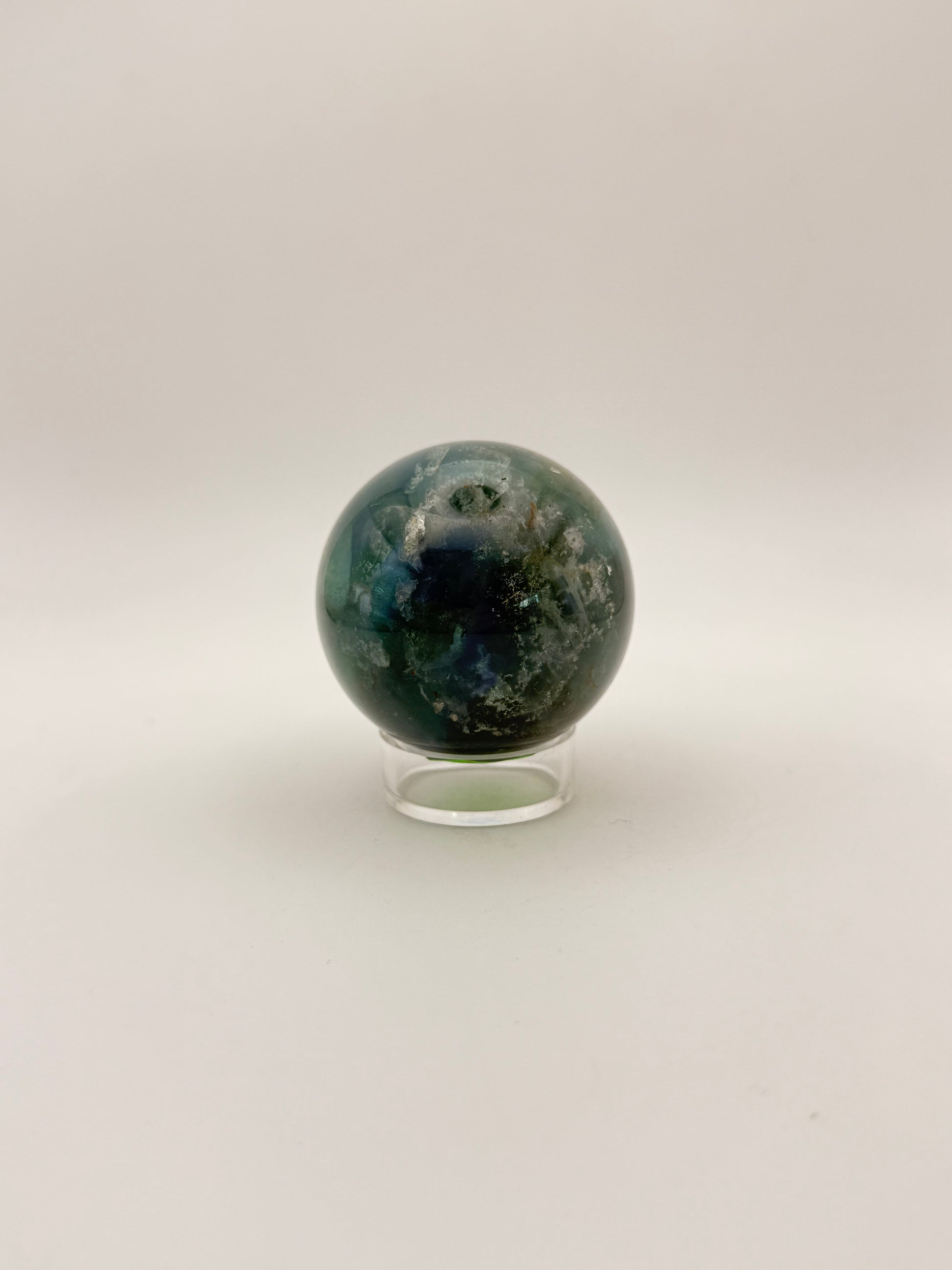 Rainbow Fluorite polished crystal sphere.