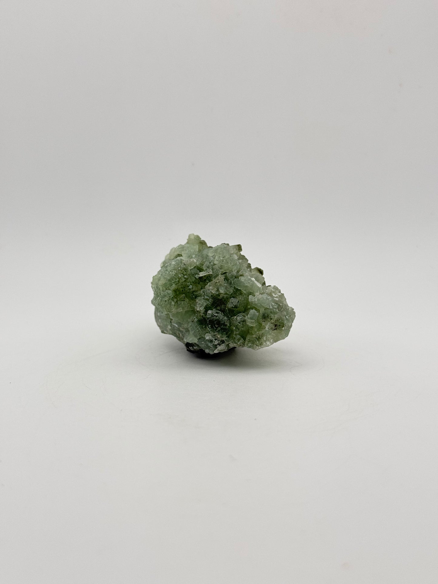 Raw Prehnite specimen with amazing green color.