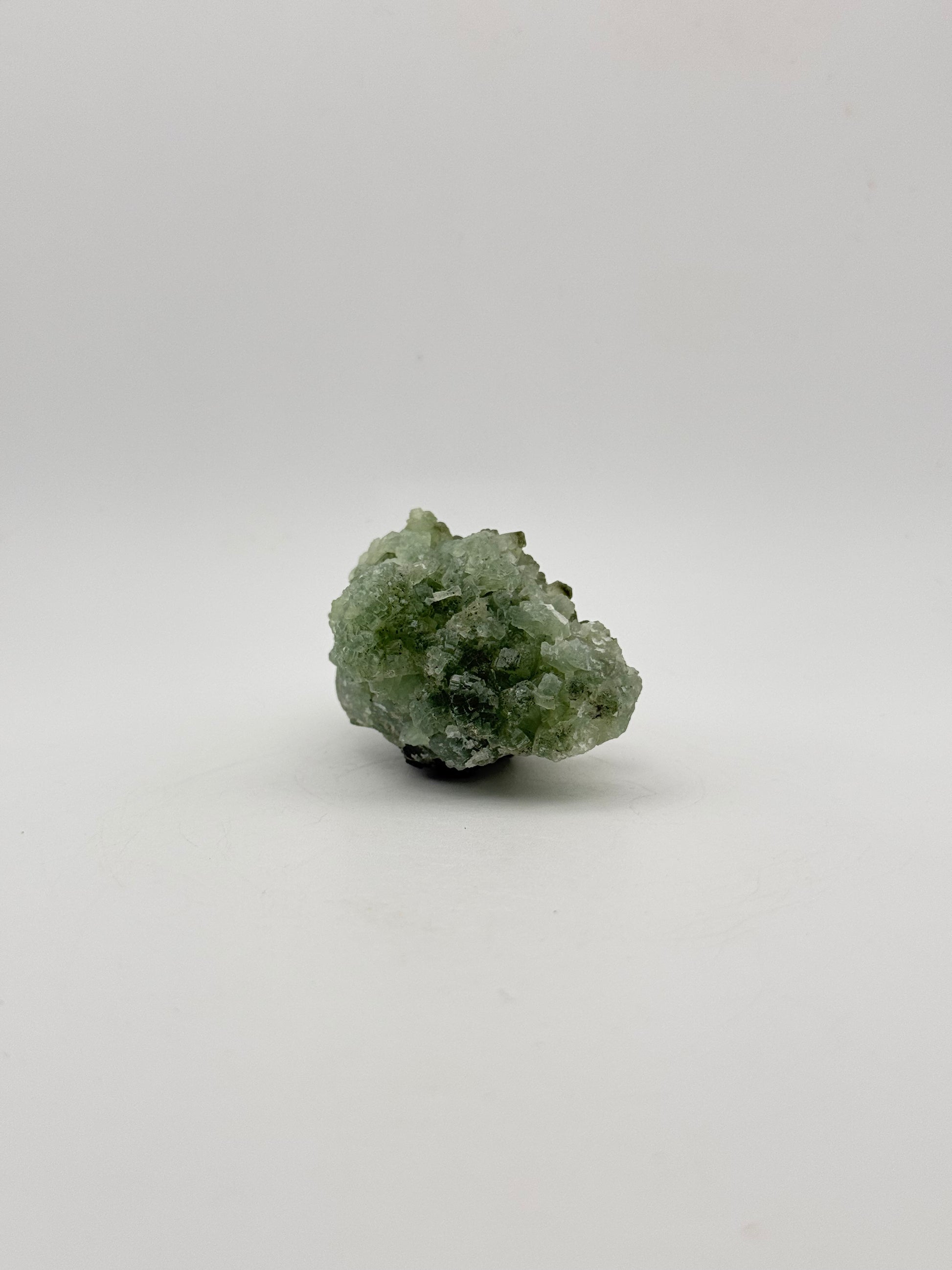 Raw Prehnite specimen with amazing green color.