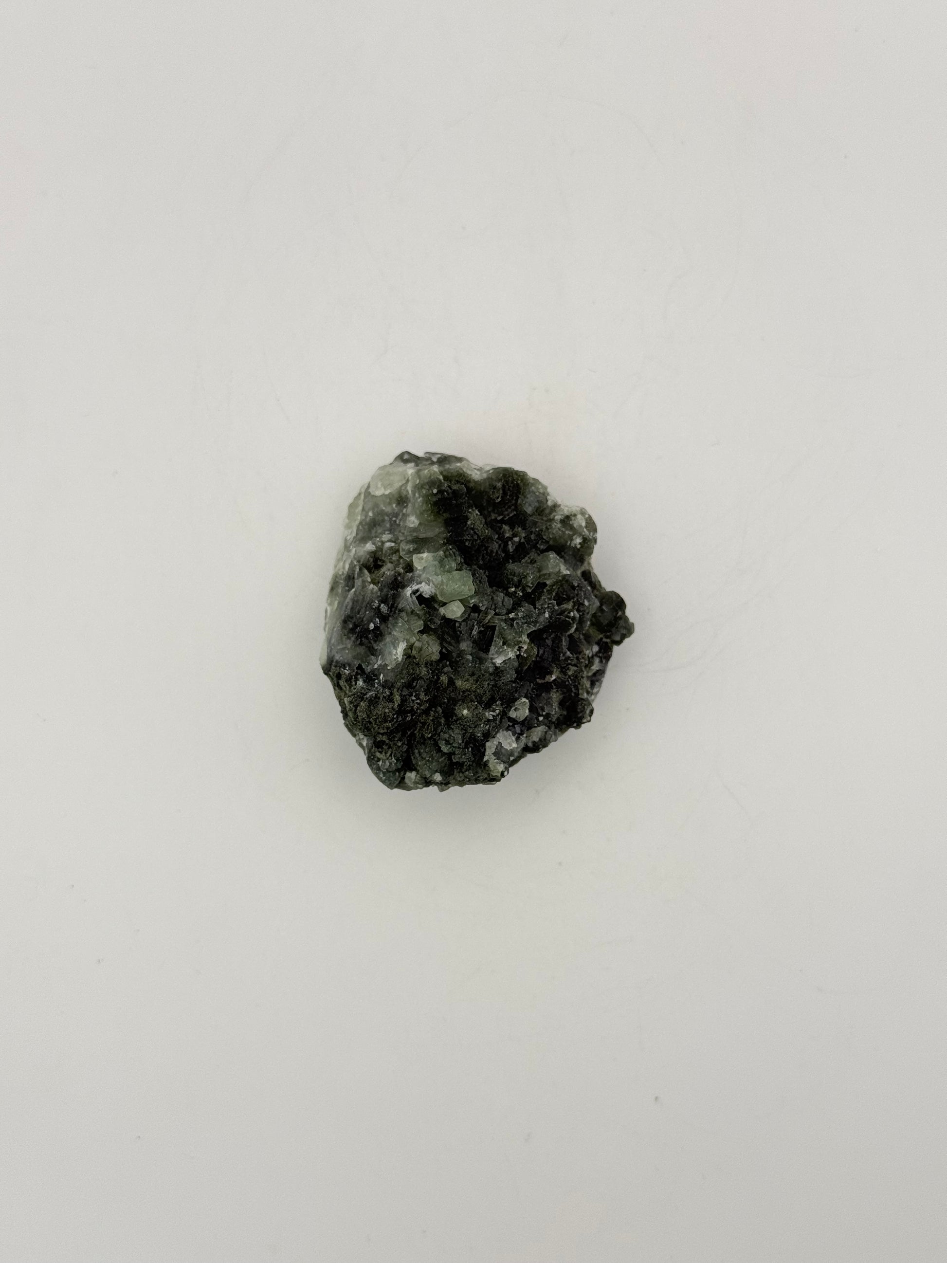 Raw Prehnite specimen with amazing green color.