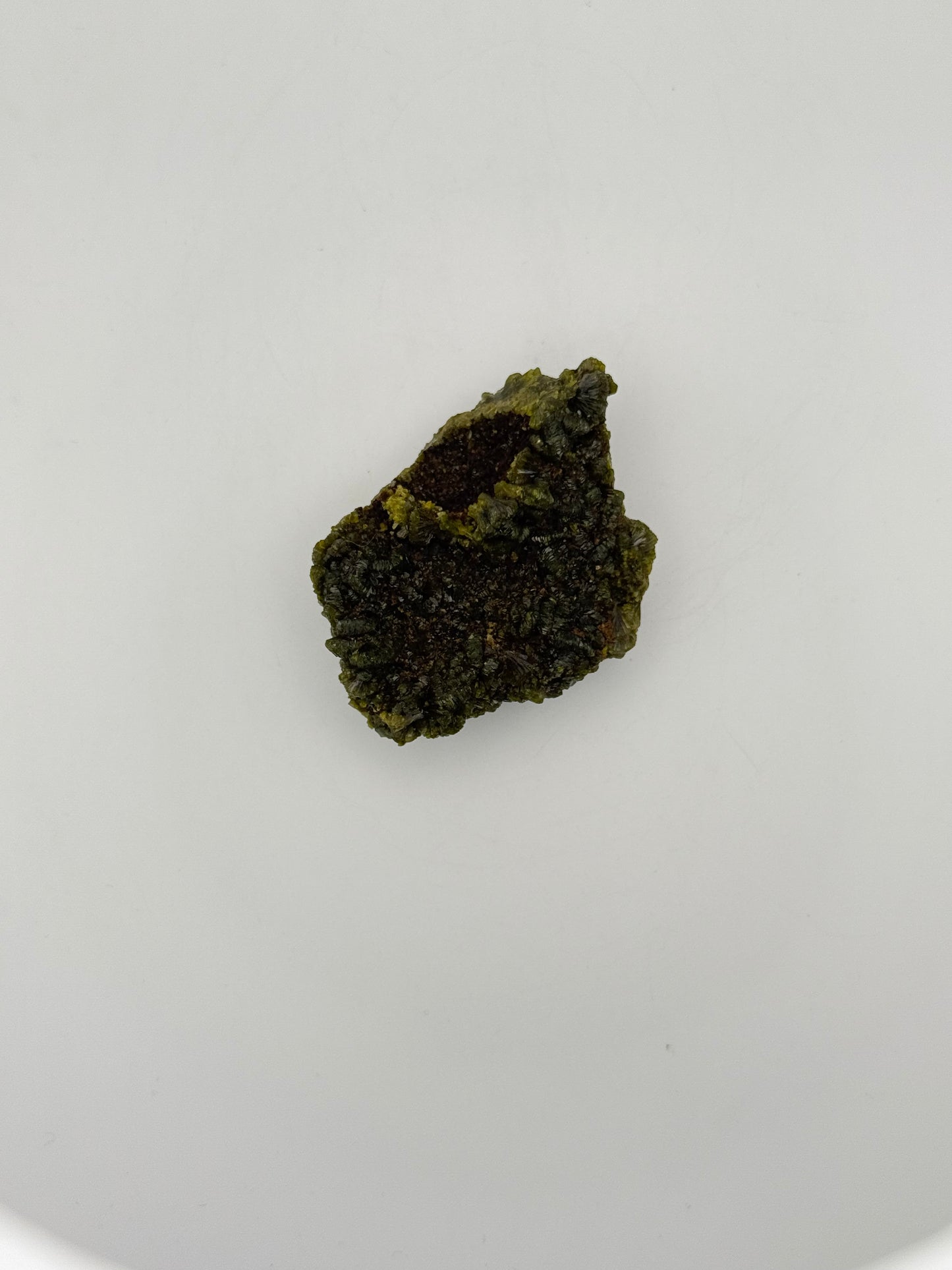 Epidote crystal cluster with good green color.