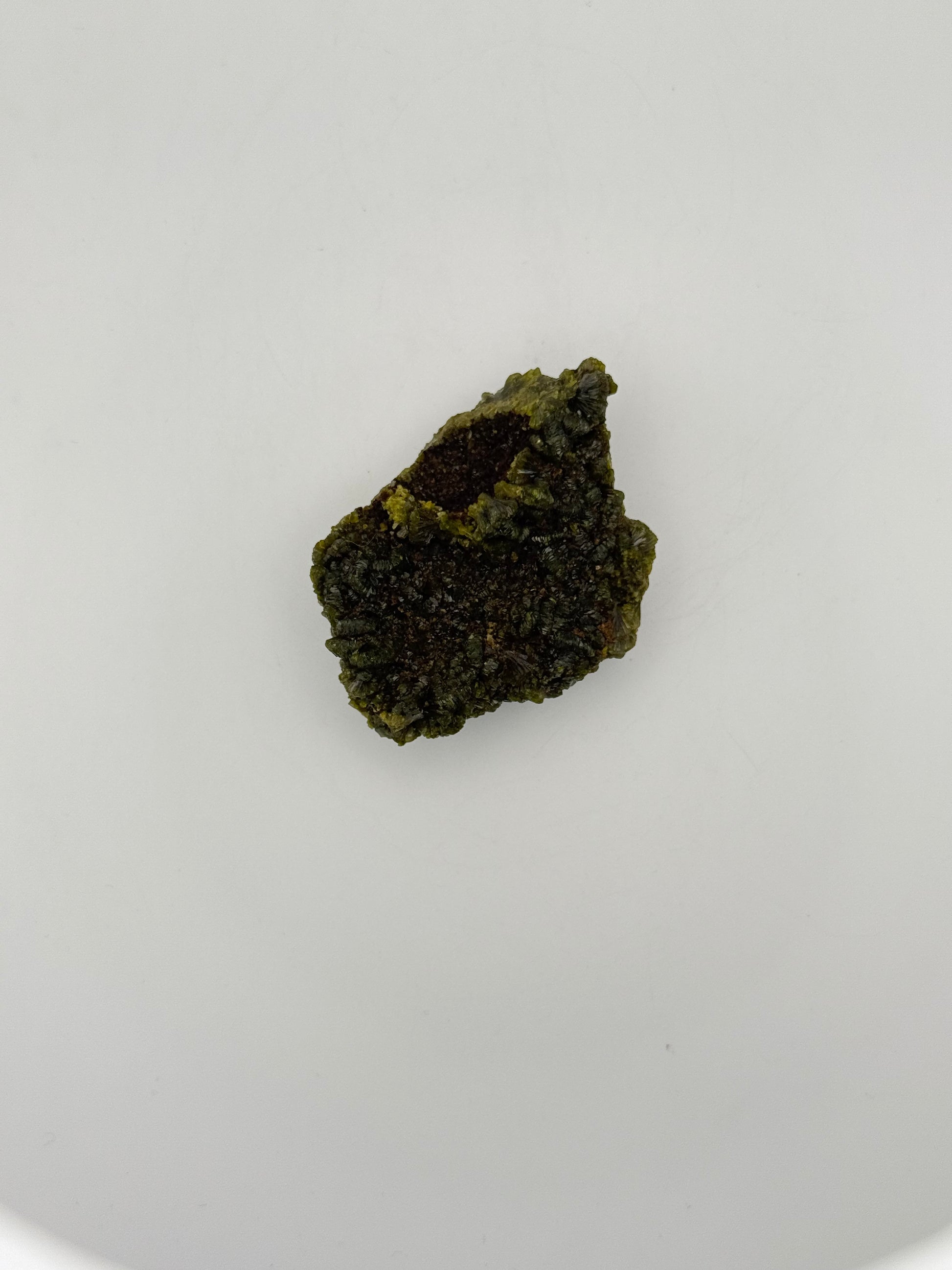 Epidote crystal cluster with good green color.