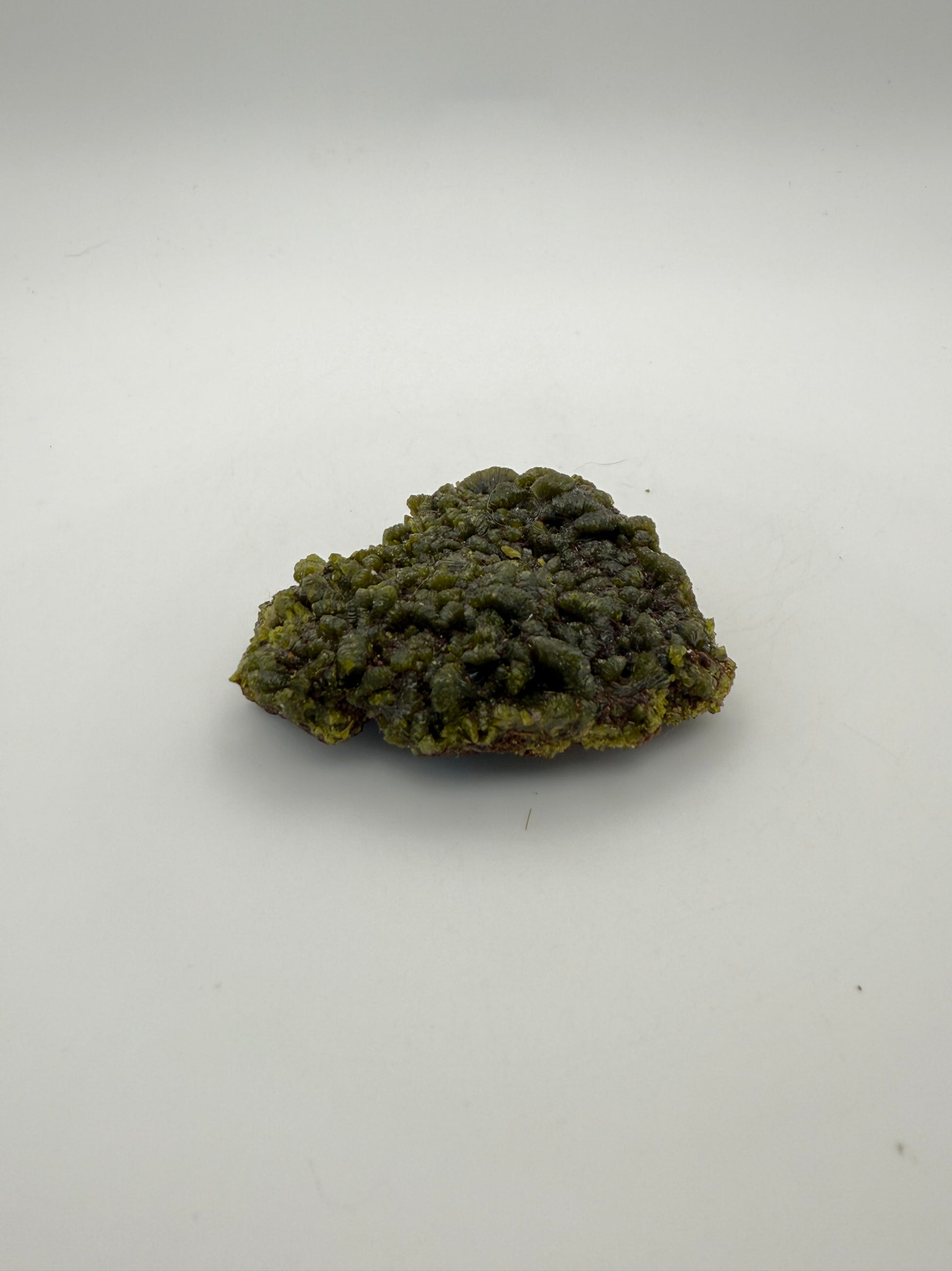 Epidote crystal cluster with good green color.