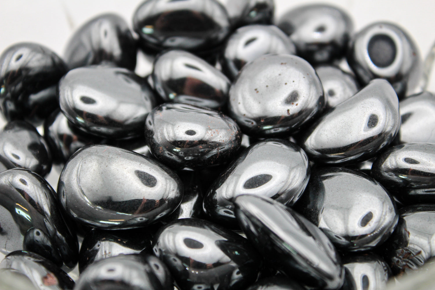 A collection of polished hematite tumbles.