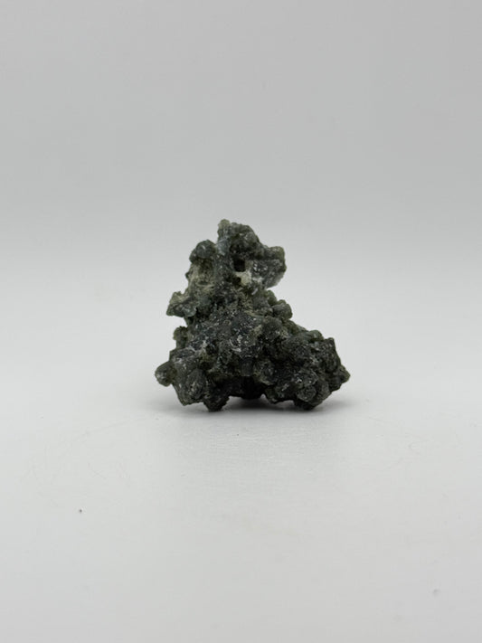 Raw prehnite specimen with amazing green color.