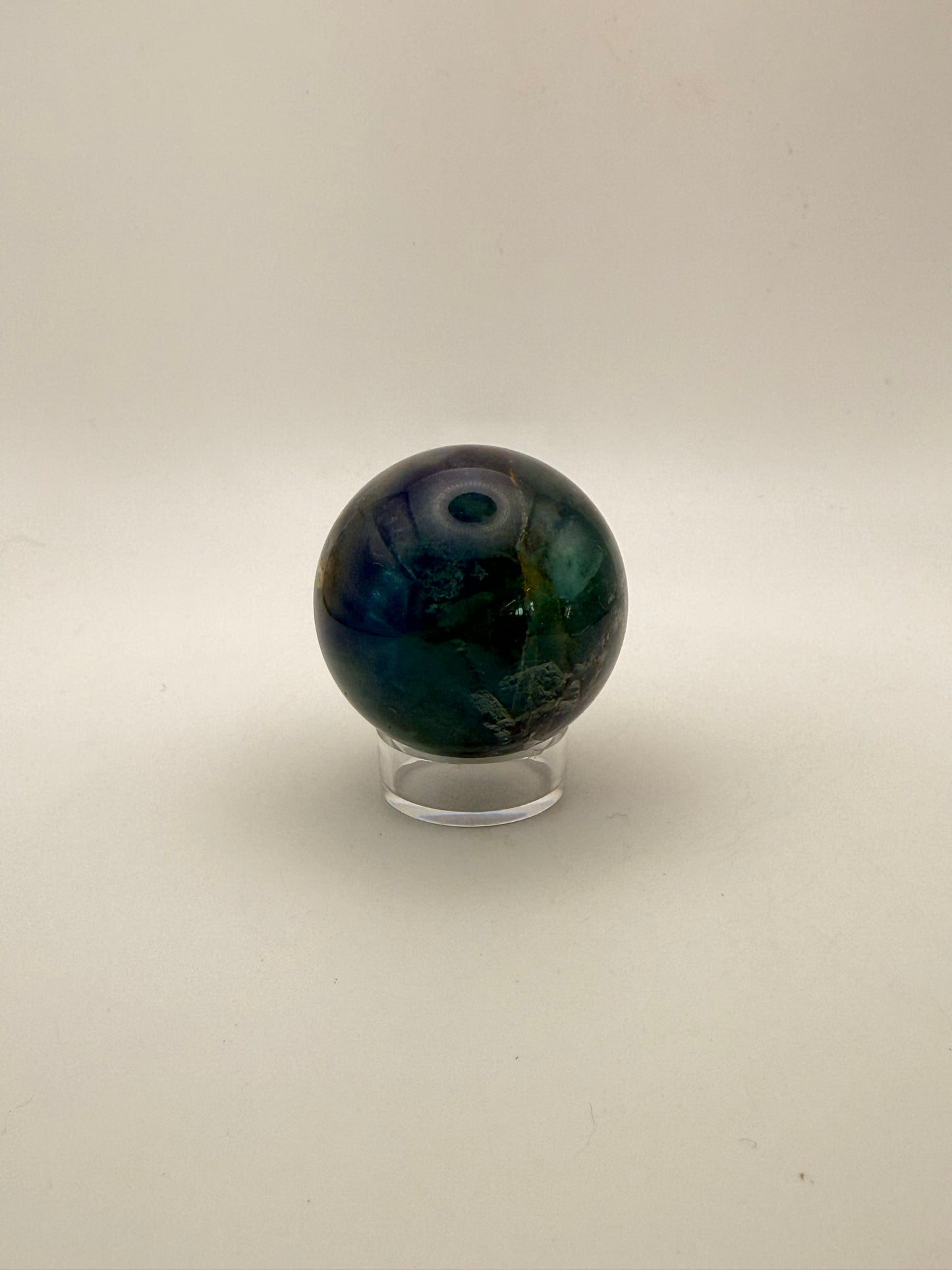 Rainbow Fluorite polished crystal sphere.