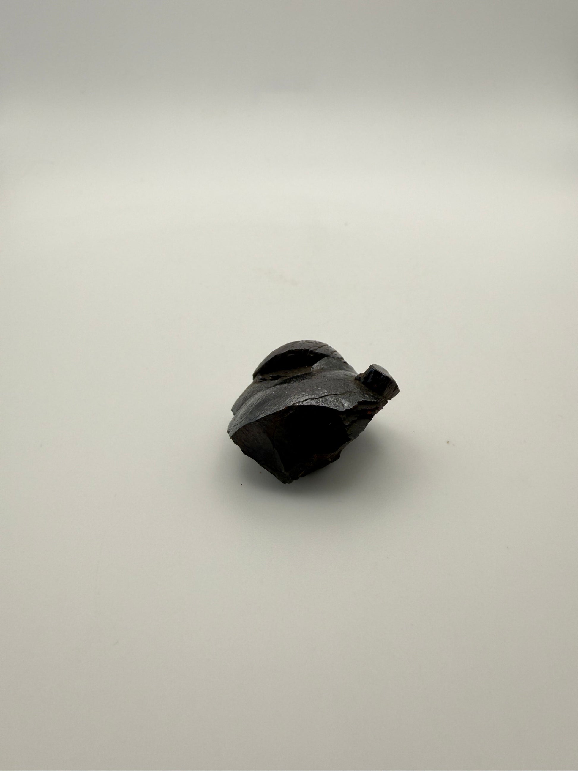 Small raw hematite specimen.