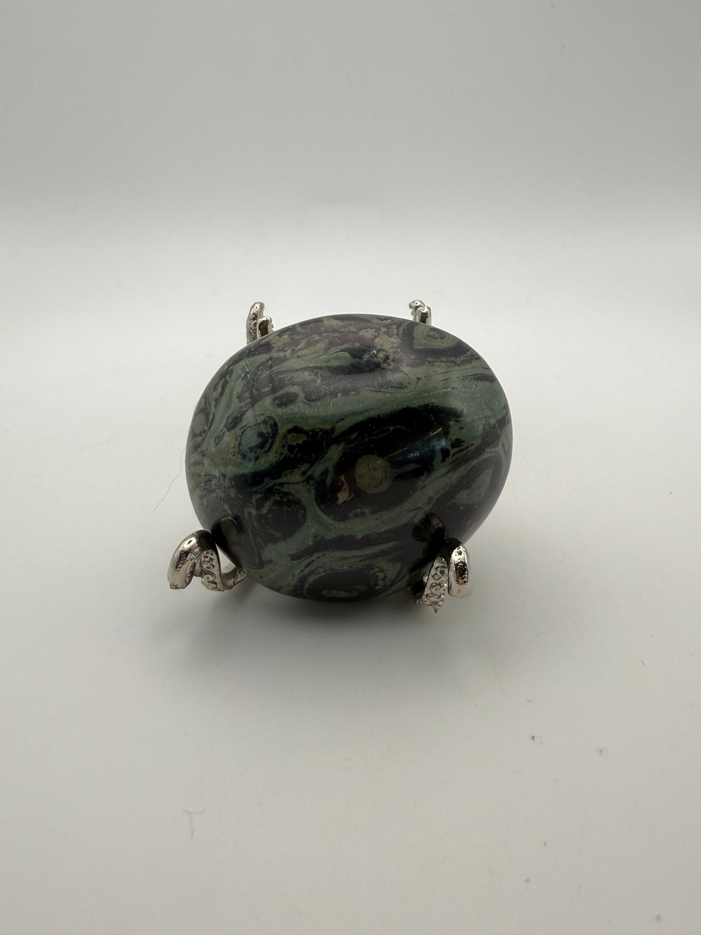 Polished kambaba jasper palm stone.