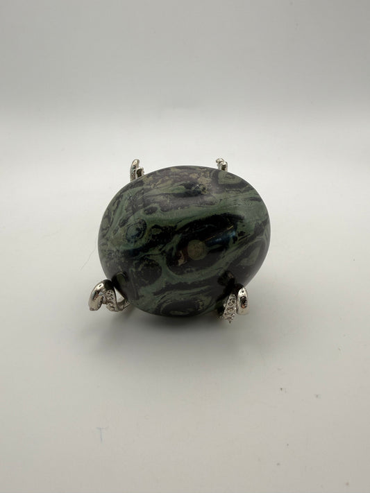 Polished kambaba jasper palm stone.