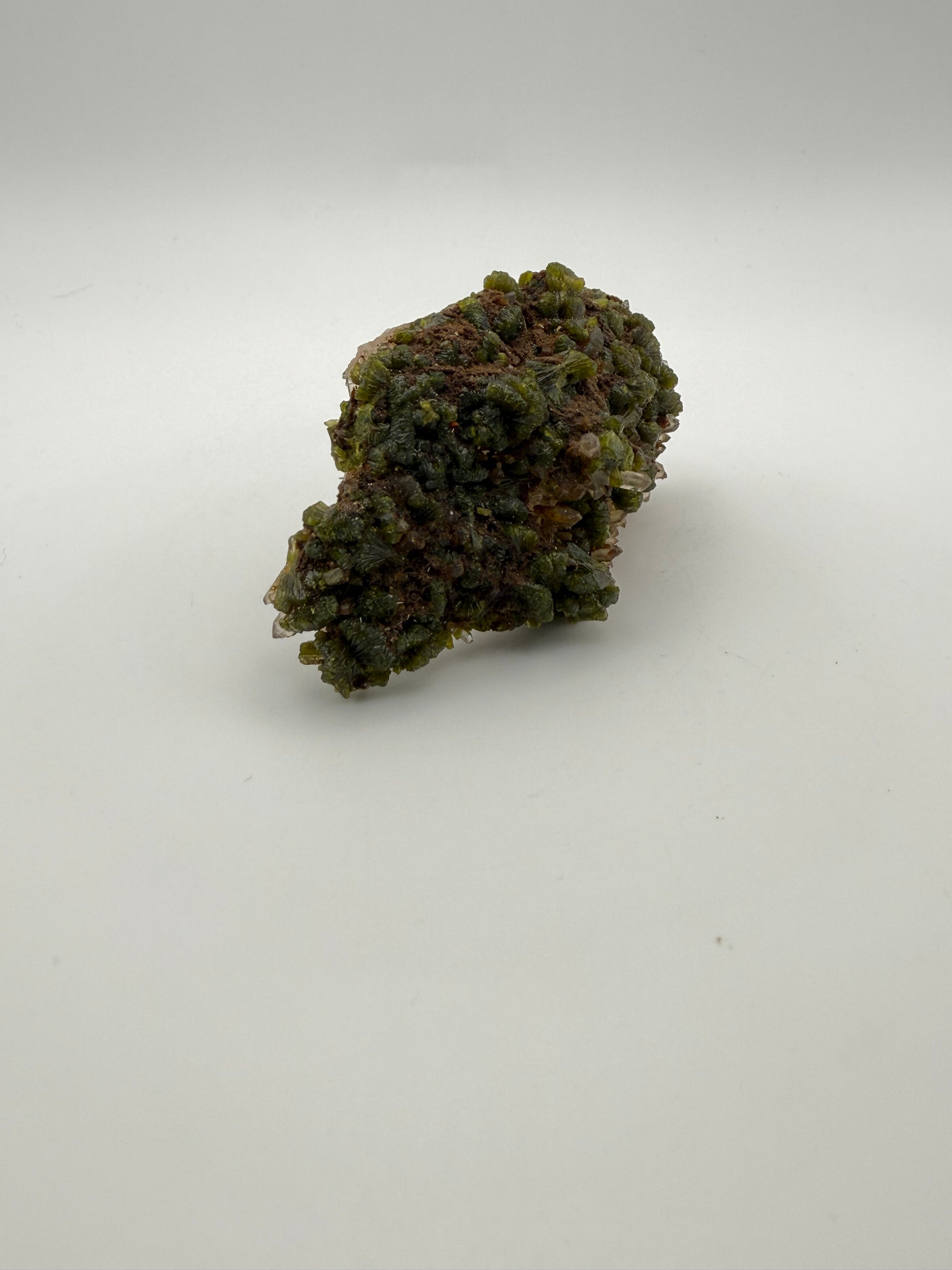 Epidote crystal cluster with good green color.