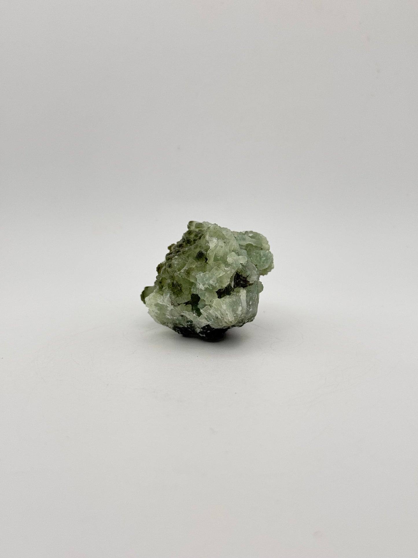 Raw Prehnite specimen with amazing green color.