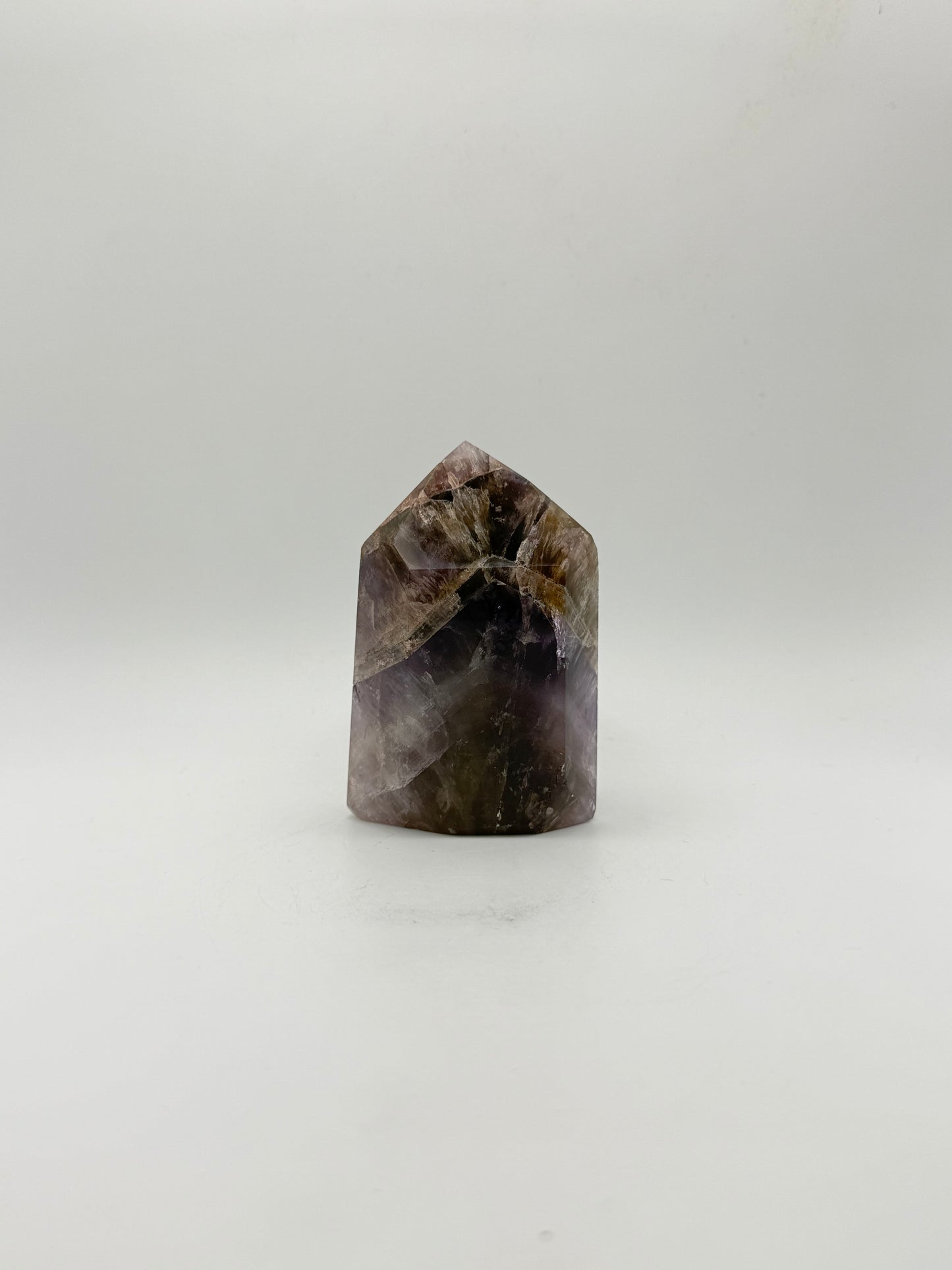 Polished super 7 in the shape of a tower.