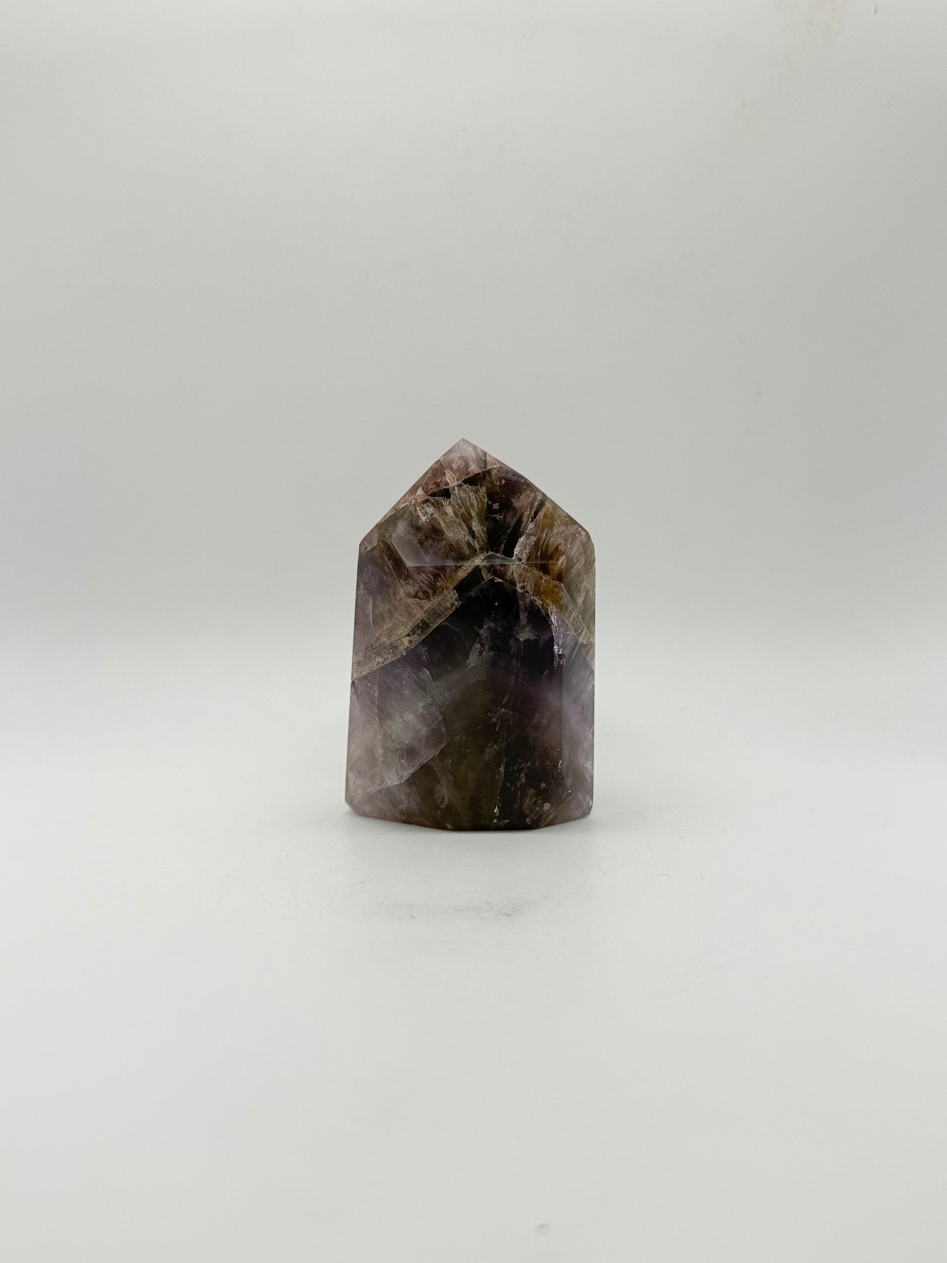 Polished super 7 in the shape of a tower.