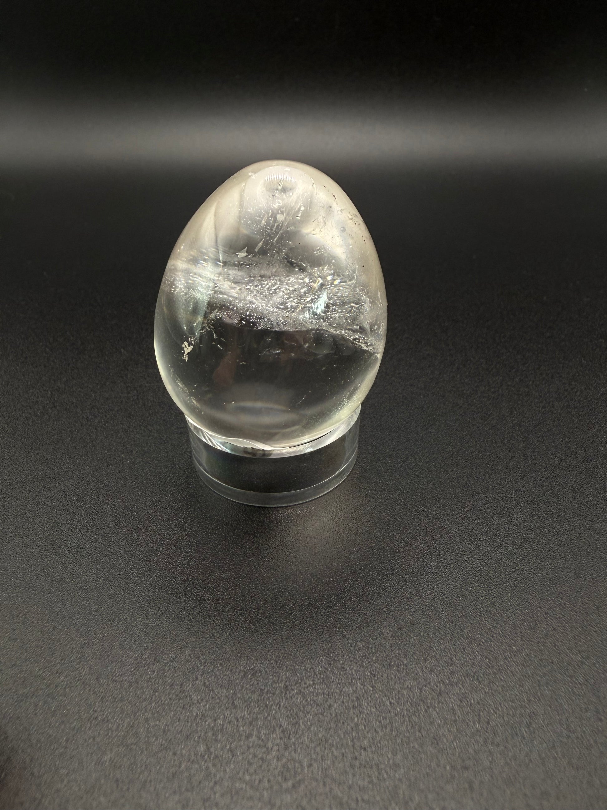 Clear quartz polished crystal in an egg shape.