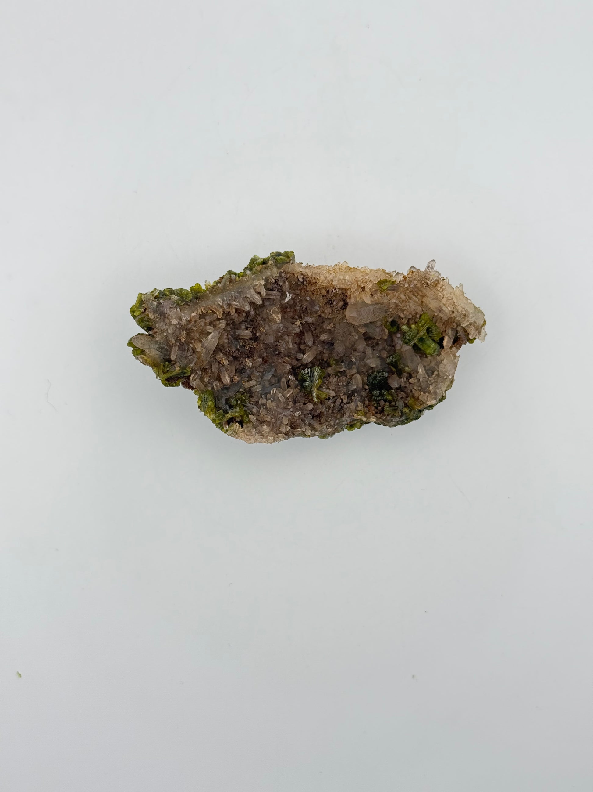 Epidote crystal cluster with good green color.