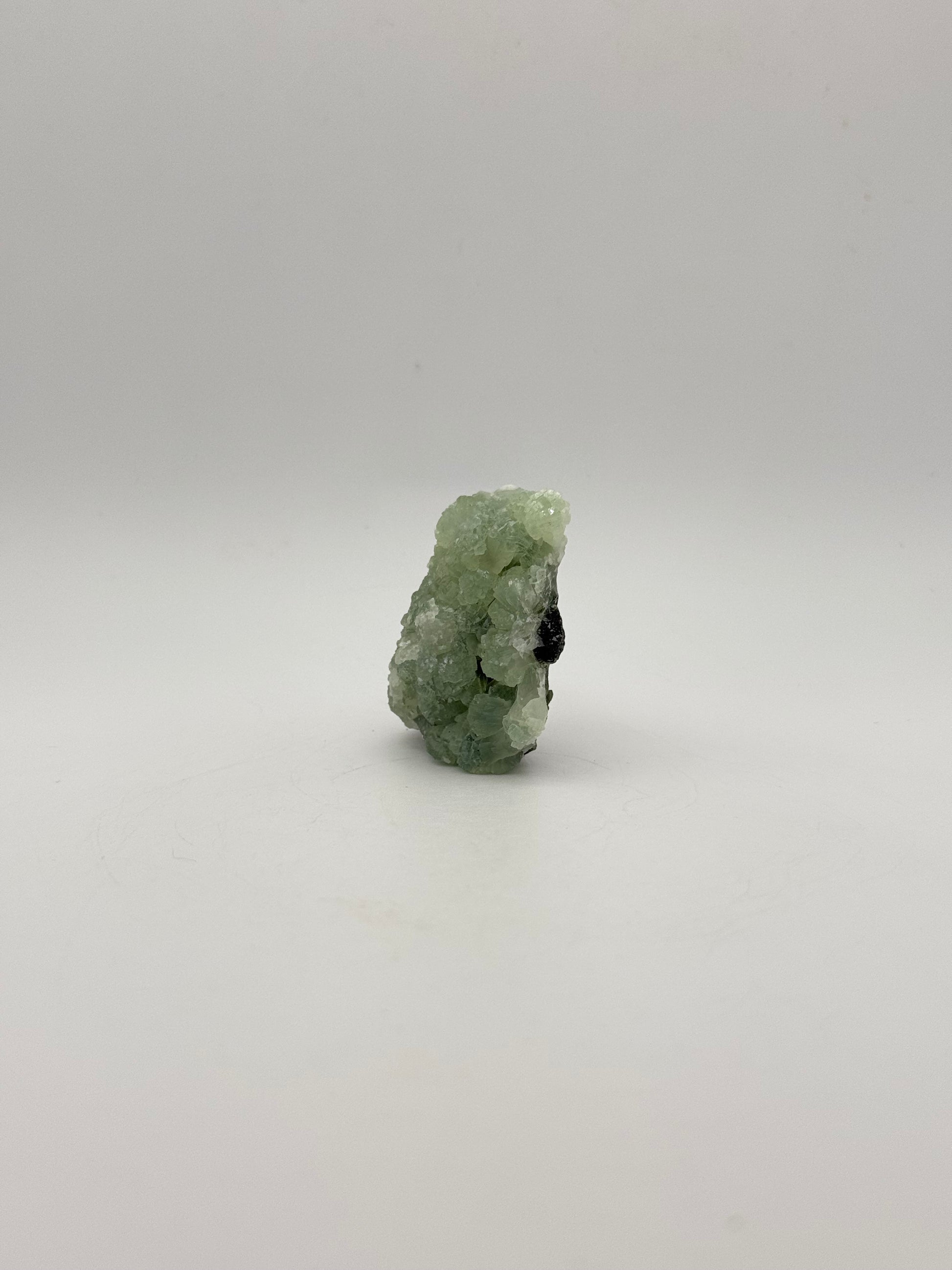 Raw Prehnite specimen with amazing green color.