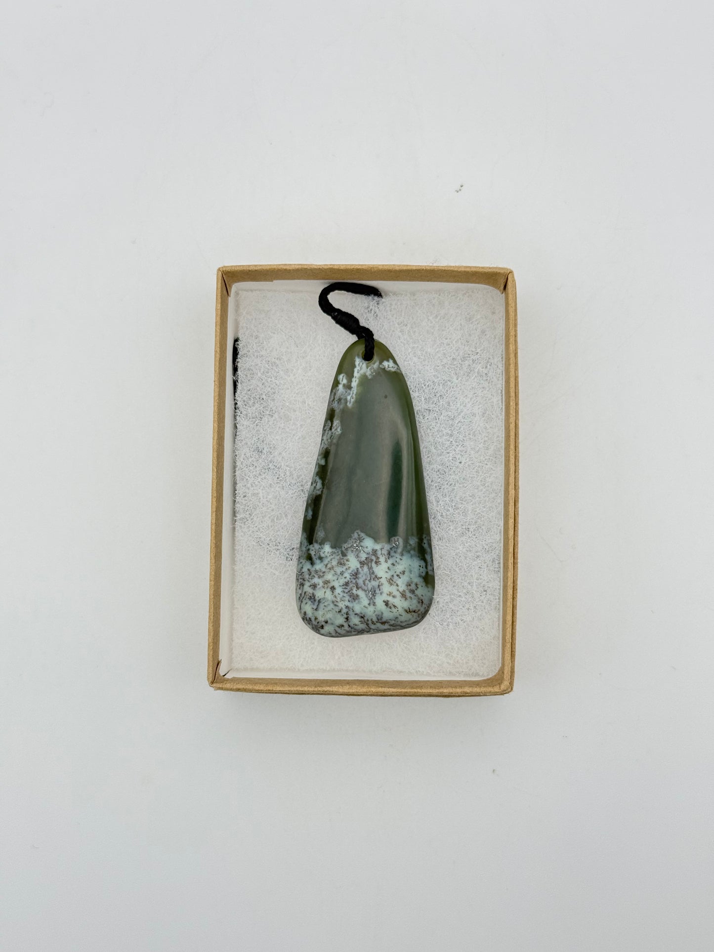 Green Jade pendant with string necklace.