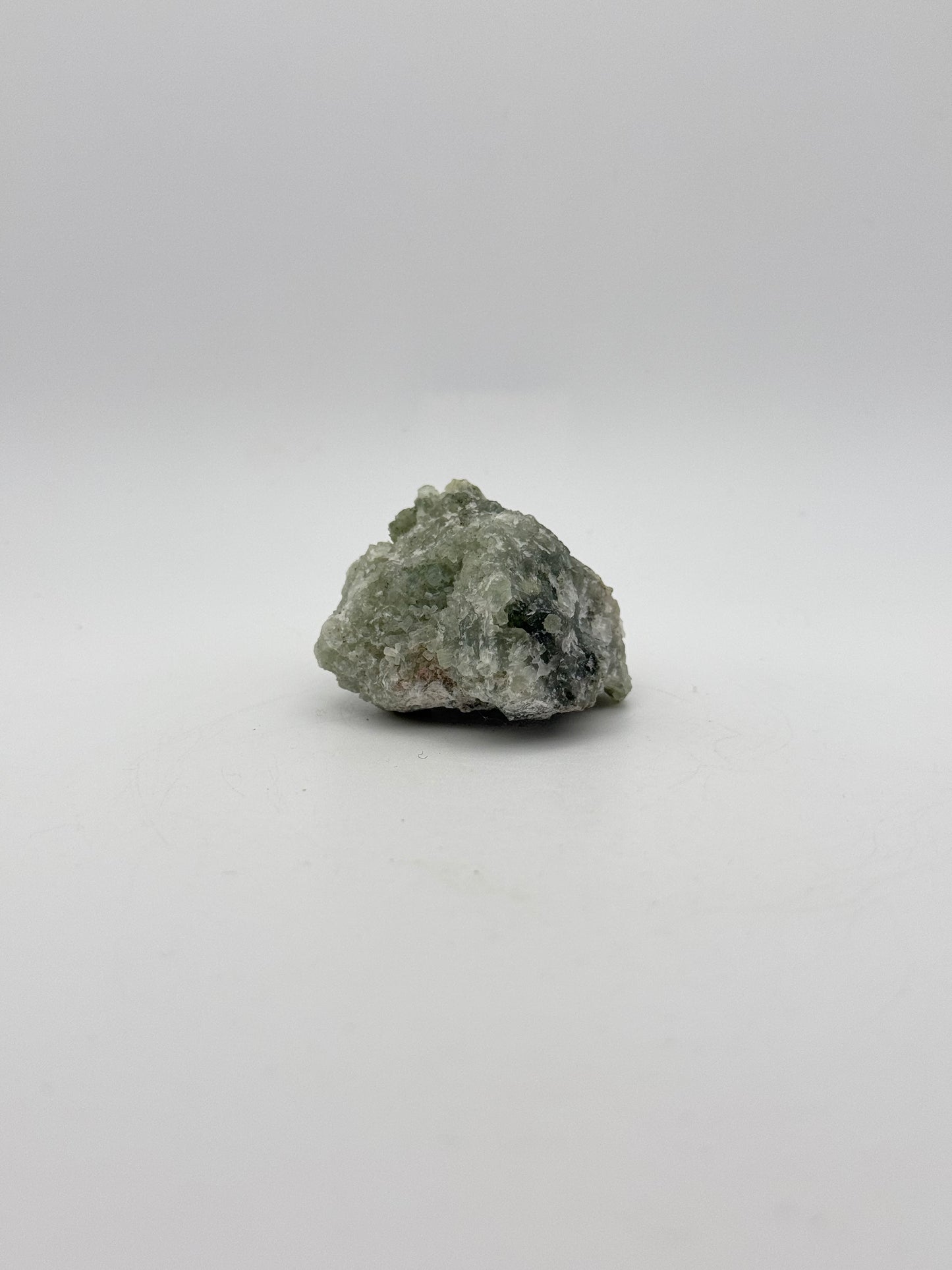 Raw prehnite specimen with amazing green color.