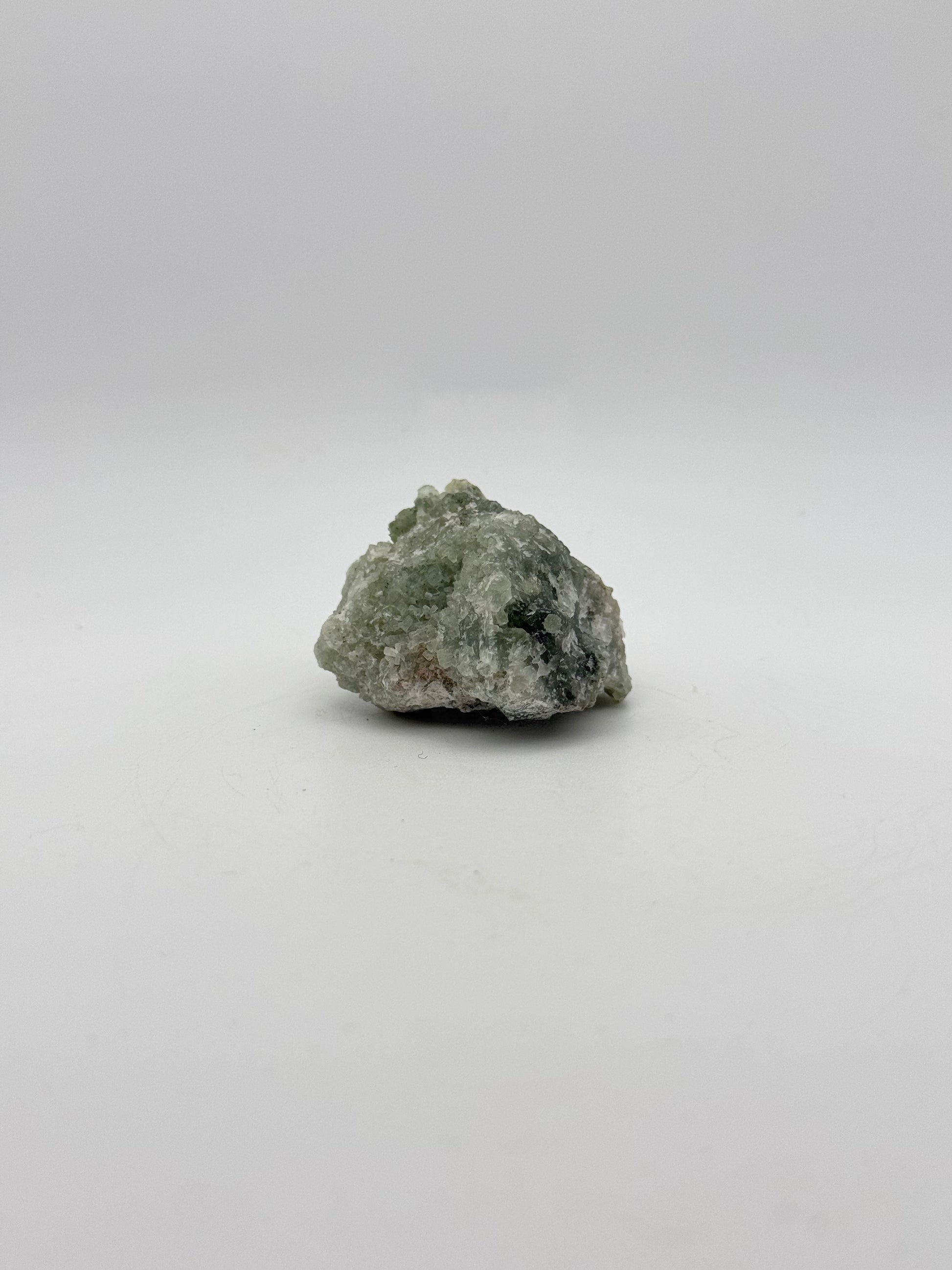 Raw prehnite specimen with amazing green color.