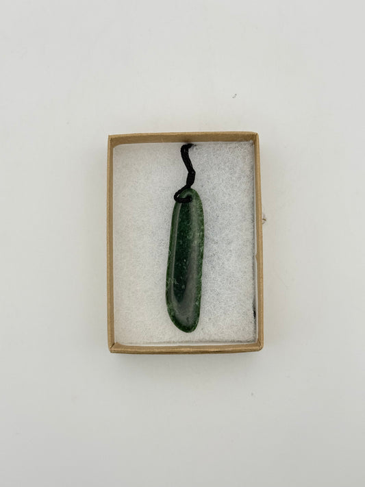 Green Jade pendant with string necklace.