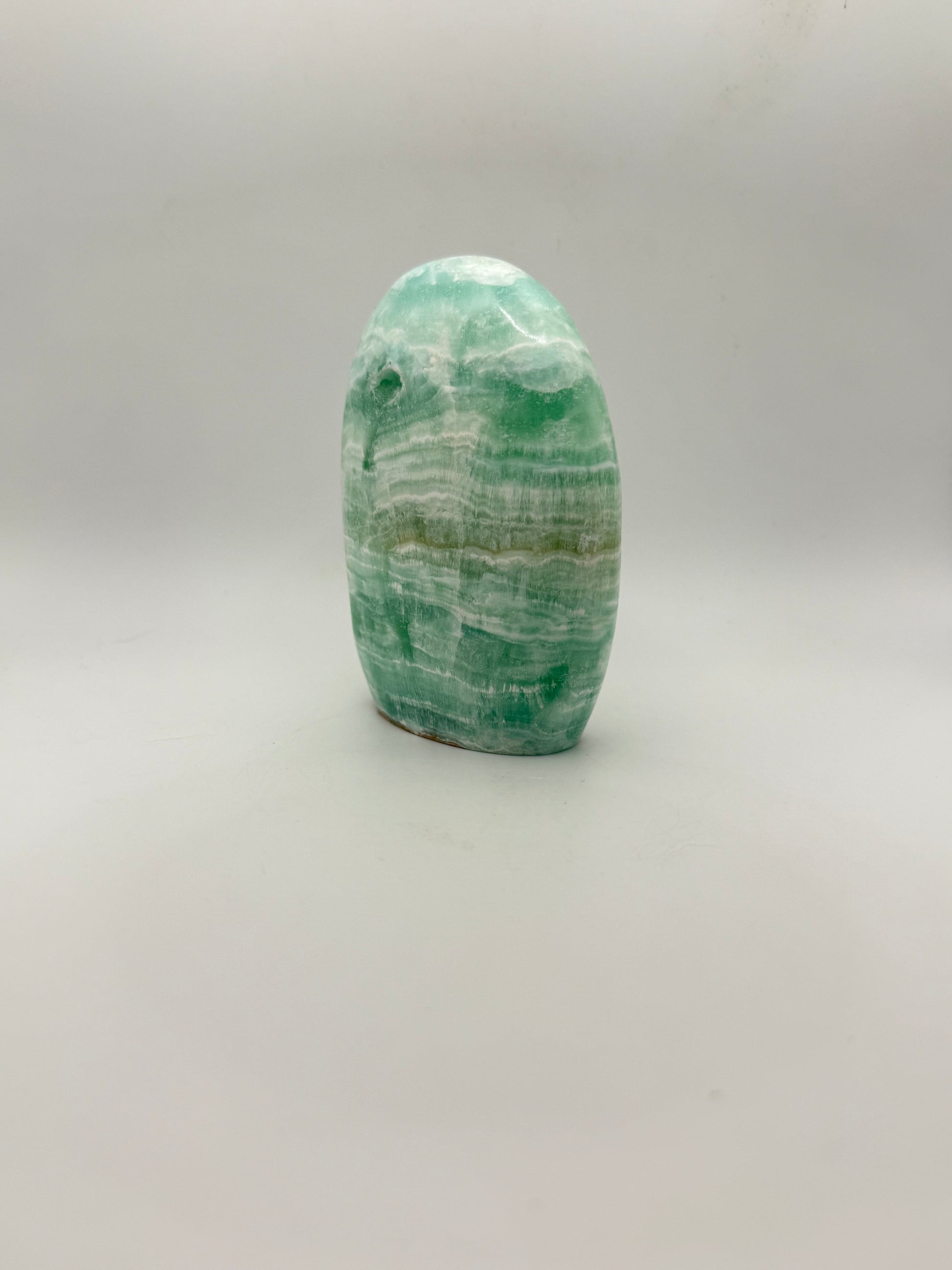 Caribbean calcite polished crystal free form in the shape of a dome.