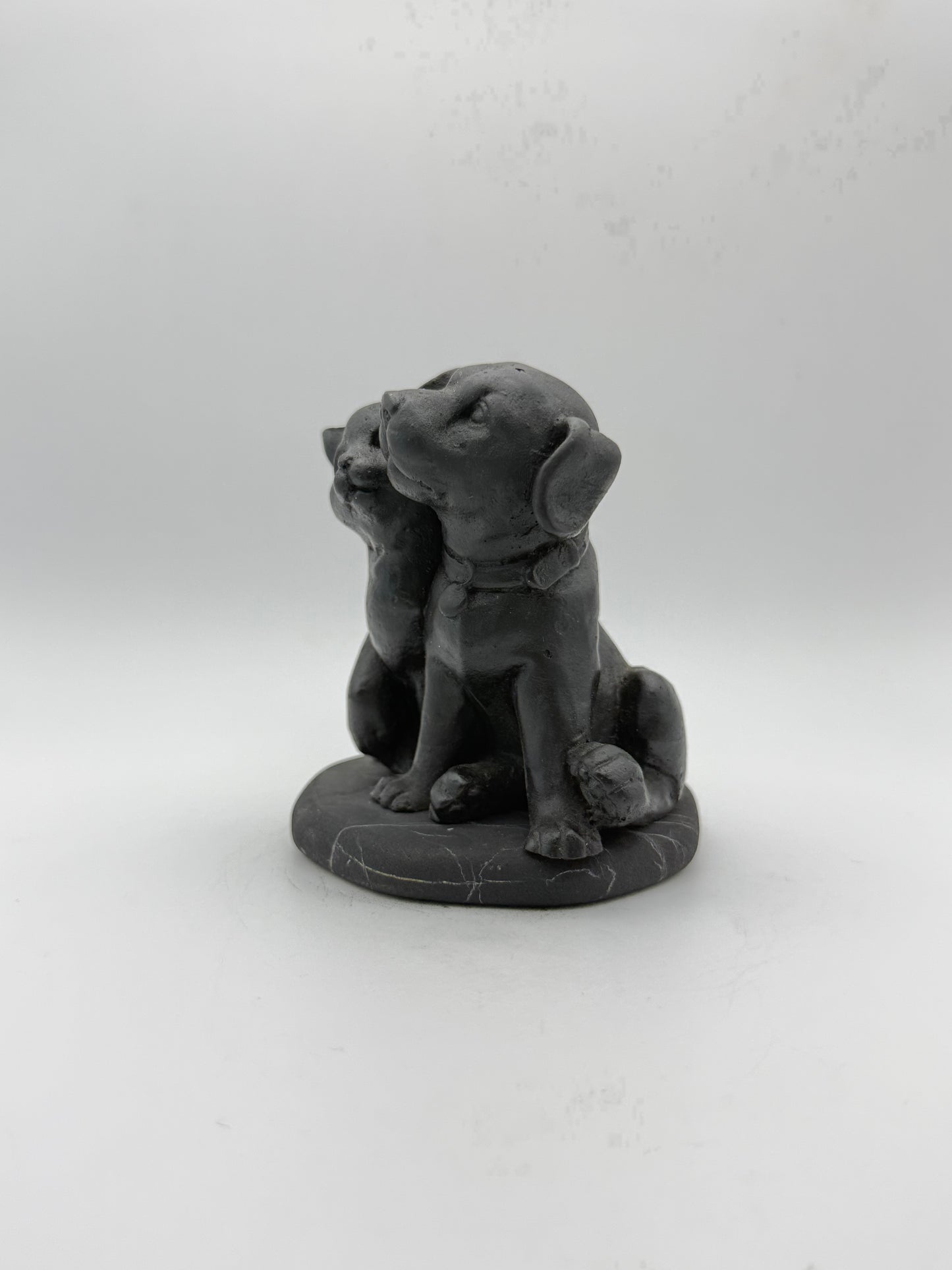 Shungite carving of a cat and dog.