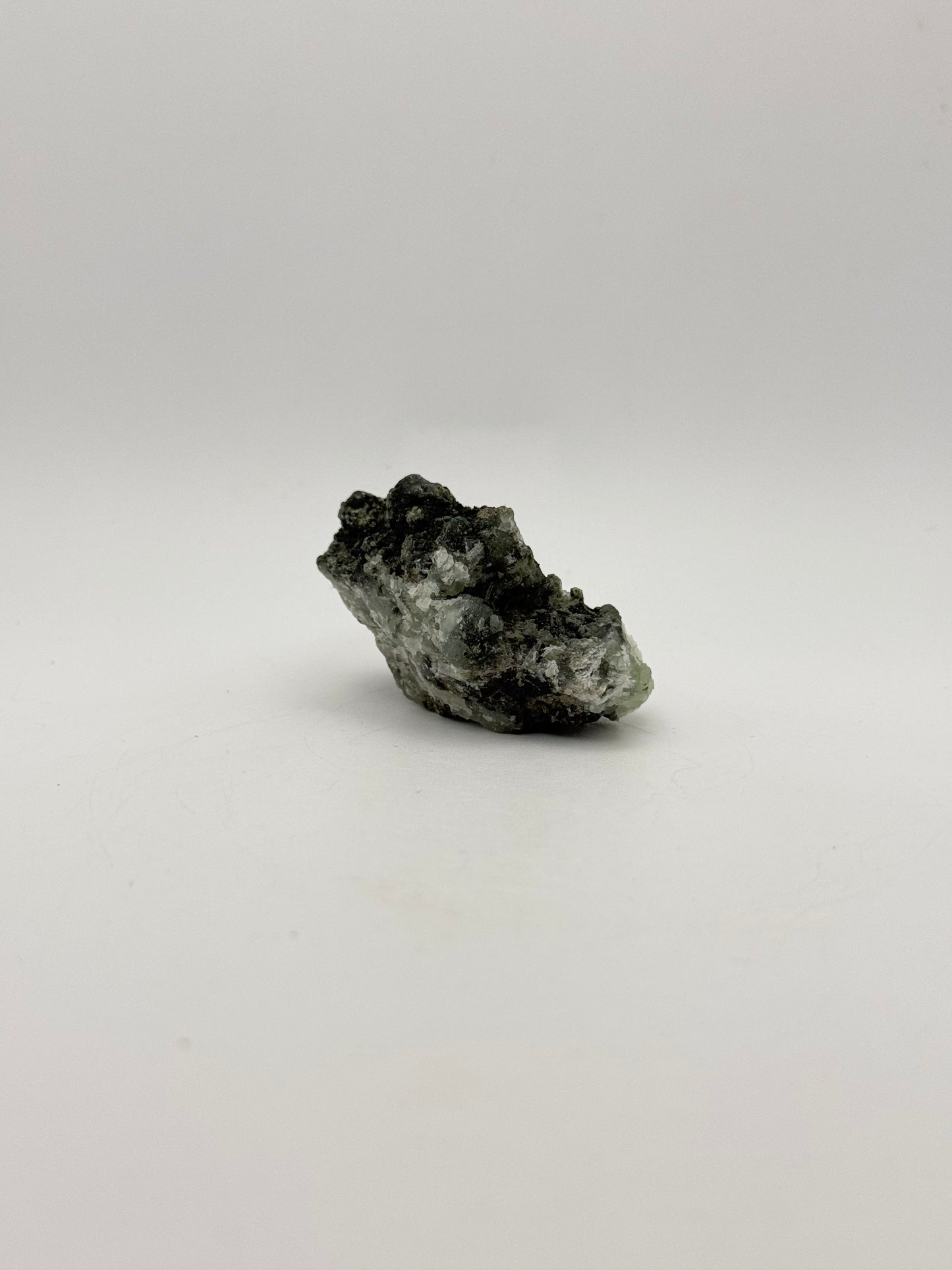 Raw prehnite specimen with amazing green color.