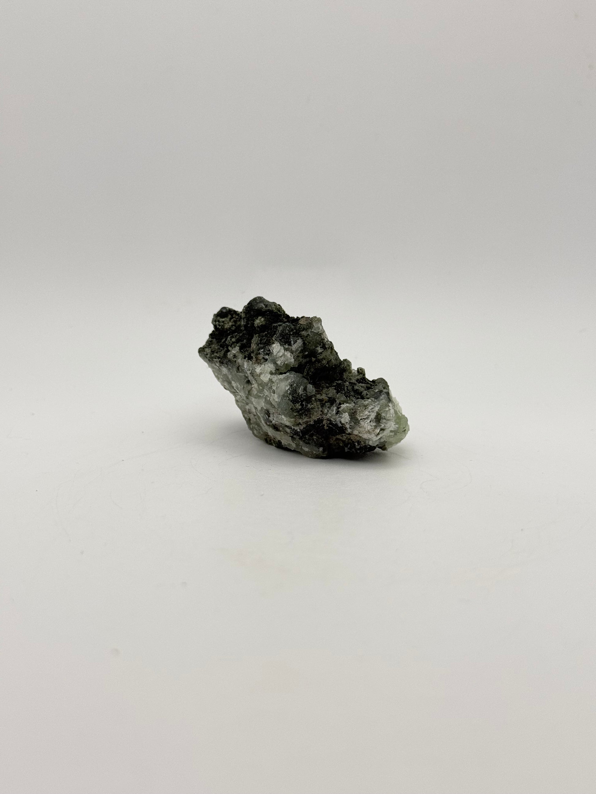 Raw prehnite specimen with amazing green color.