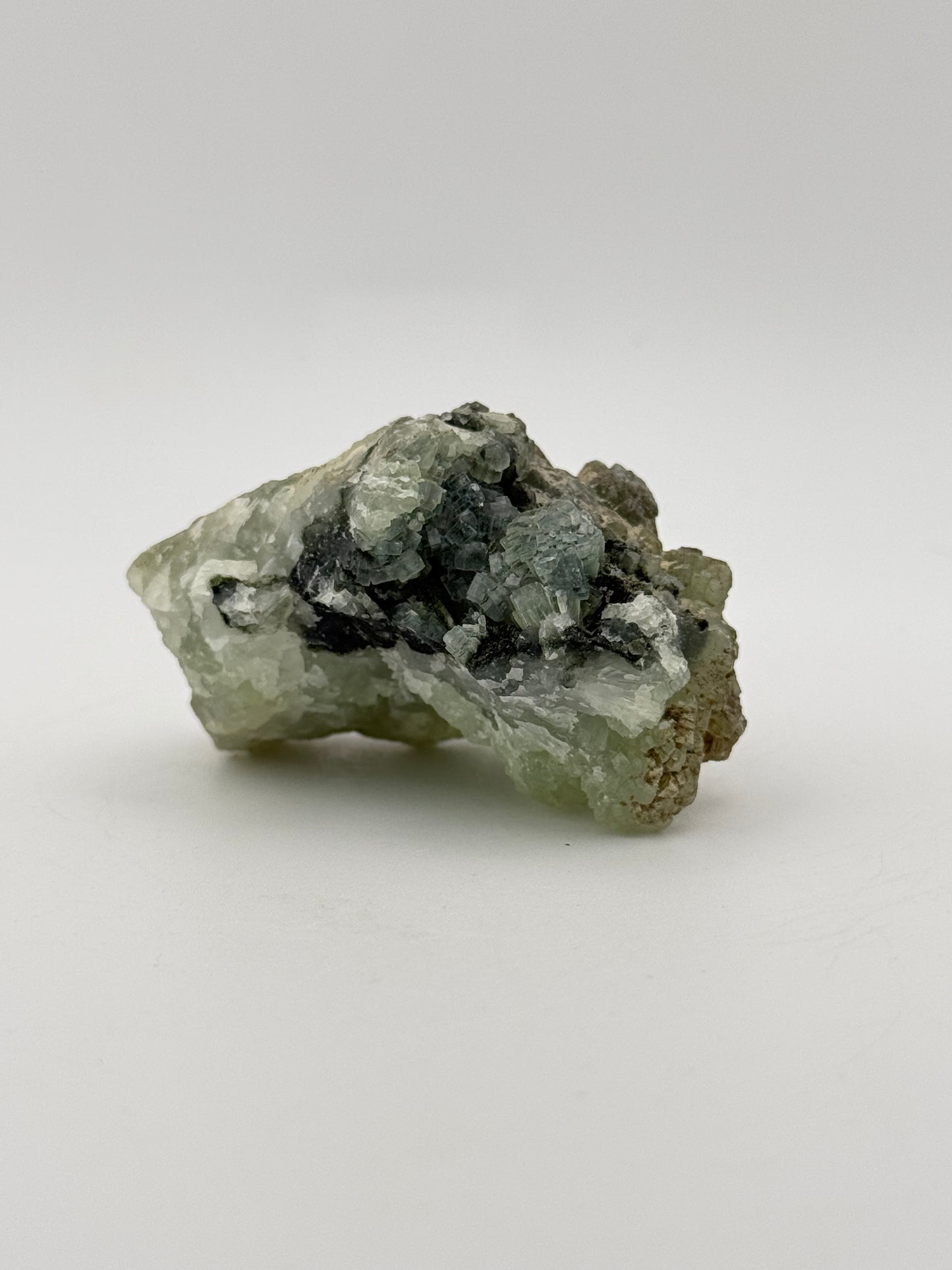 Raw Prehnite specimen with amazing green color.