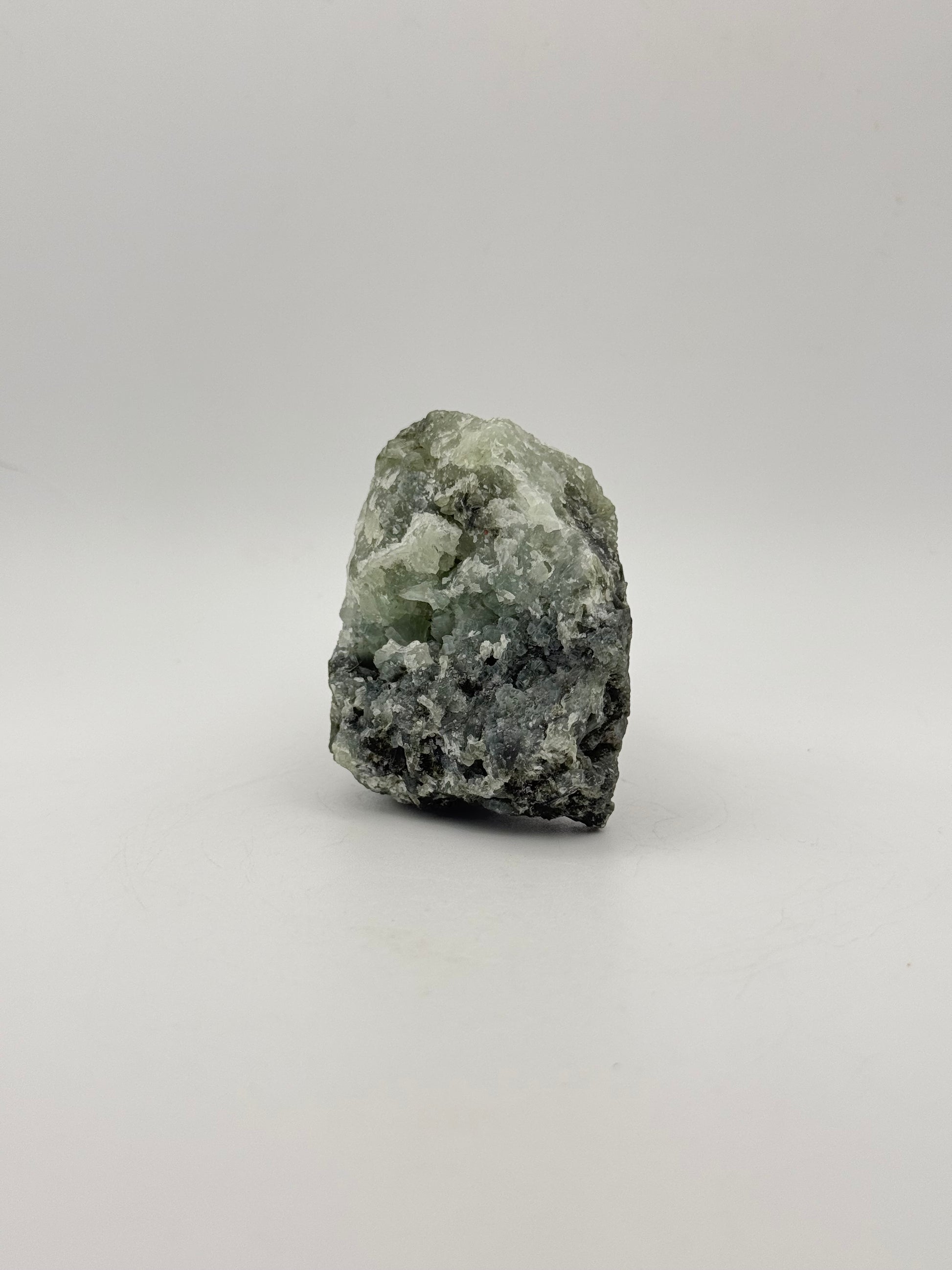 Raw Prehnite specimen with amazing green color.