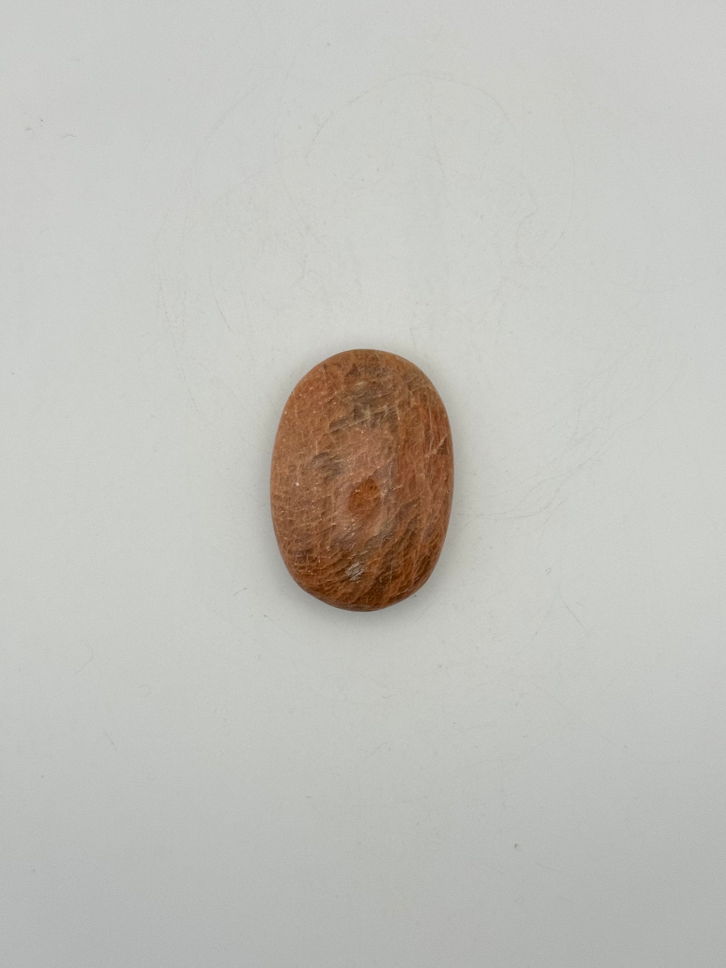 Polished Peach moonstone palm stone.