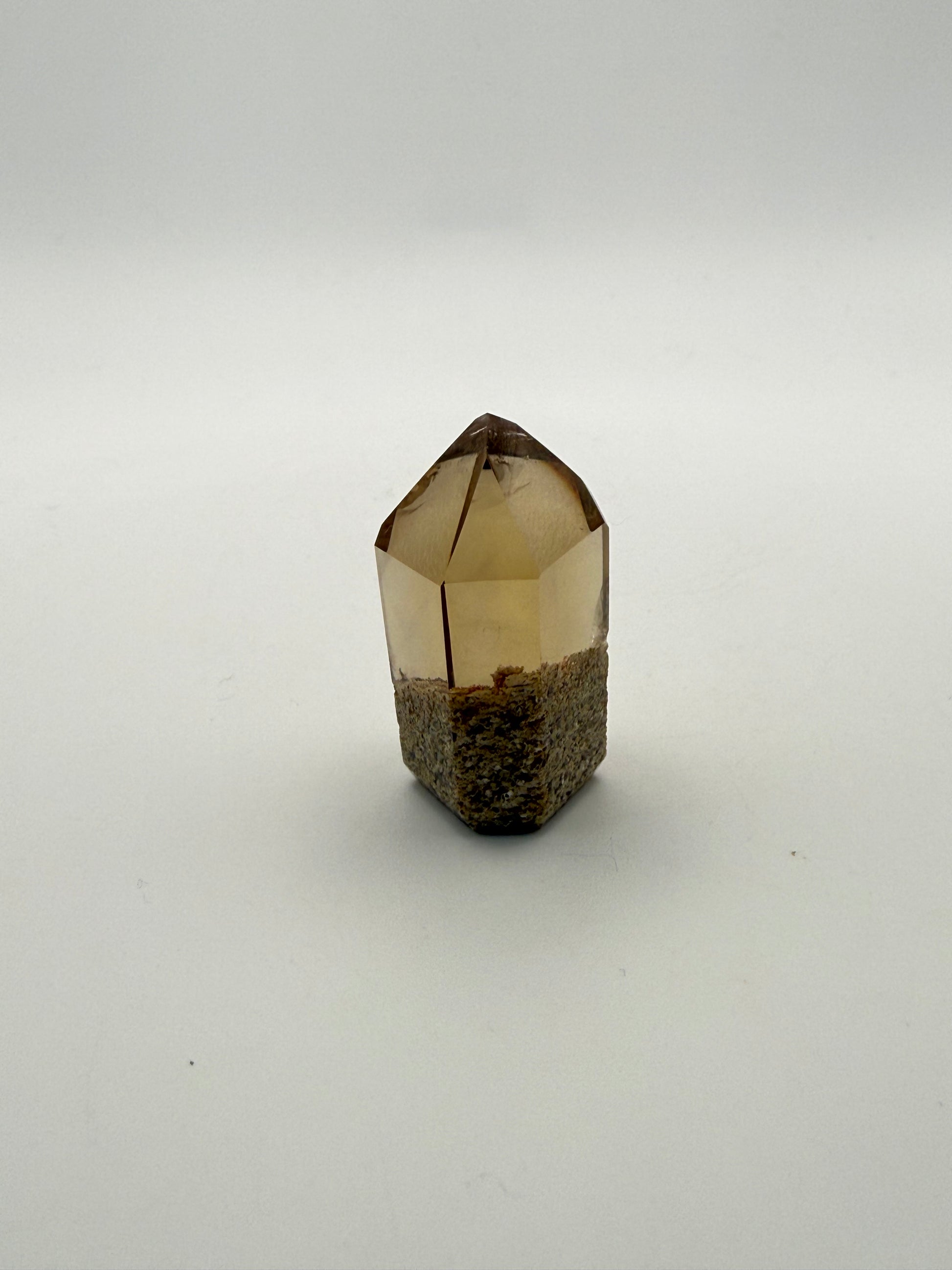 Polished natural citrine point.