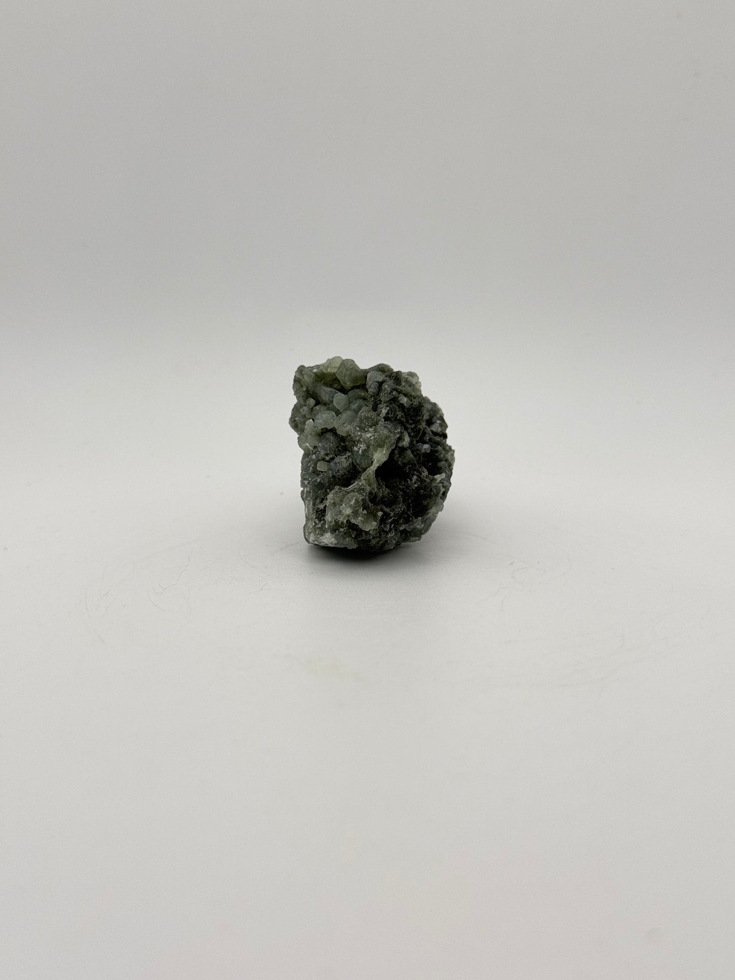 Raw Prehnite specimen with amazing green color.