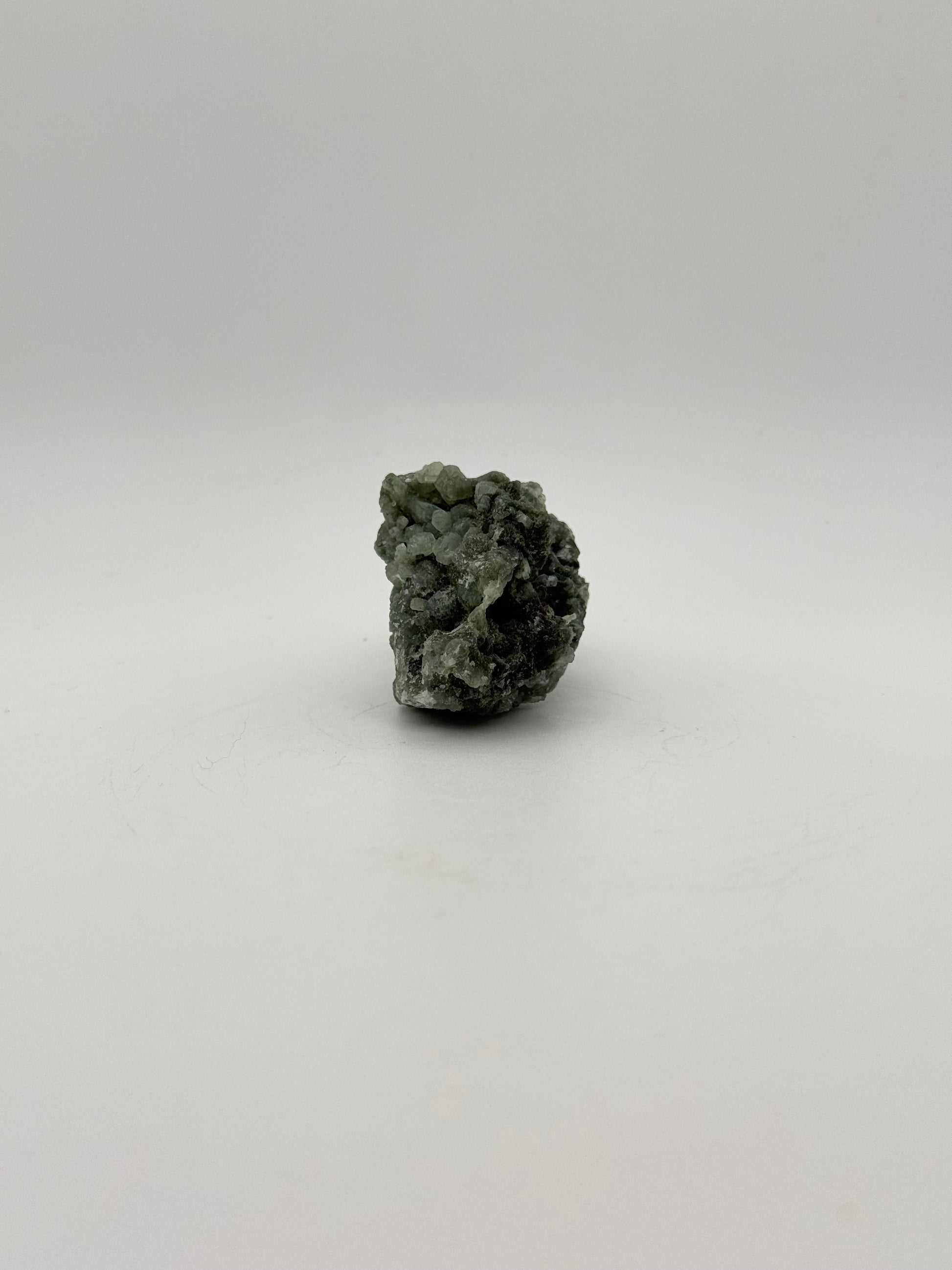 Raw Prehnite specimen with amazing green color.