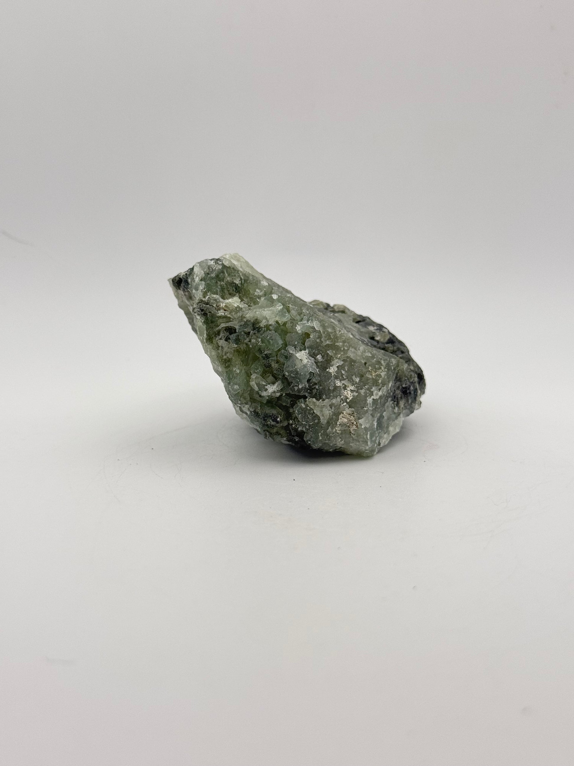 Raw Prehnite specimen with amazing green color.