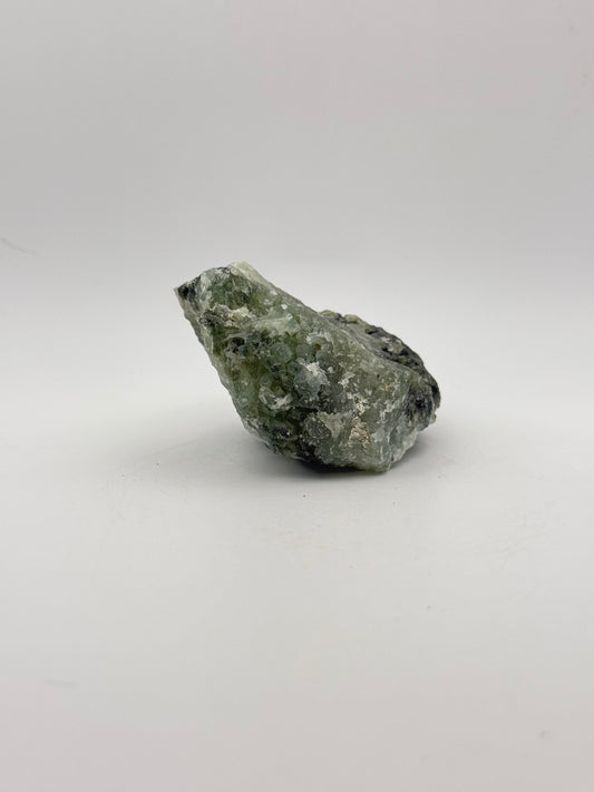 Raw Prehnite specimen with amazing green color.