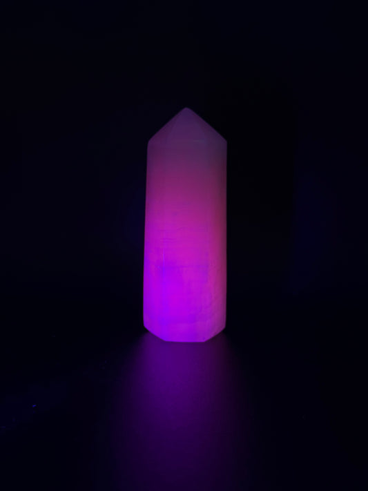 Polished pink calcite tower. Pink calcite glows under uv light.