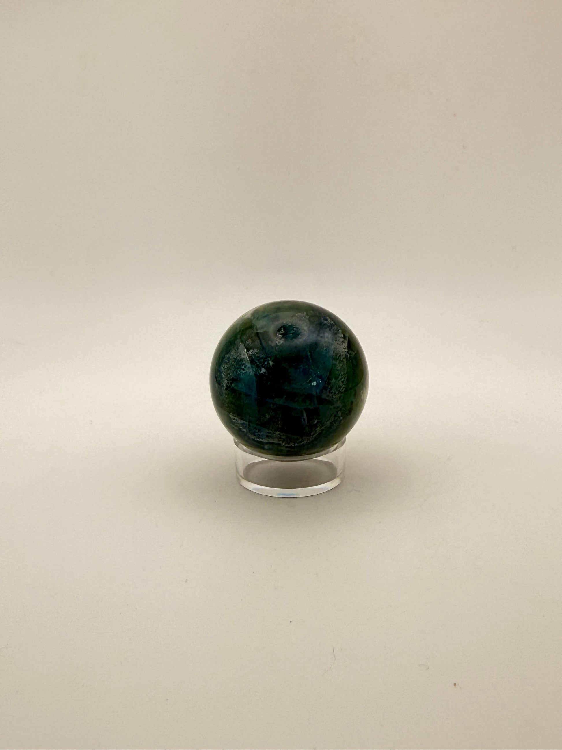 Rainbow Fluorite polished crystal sphere.
