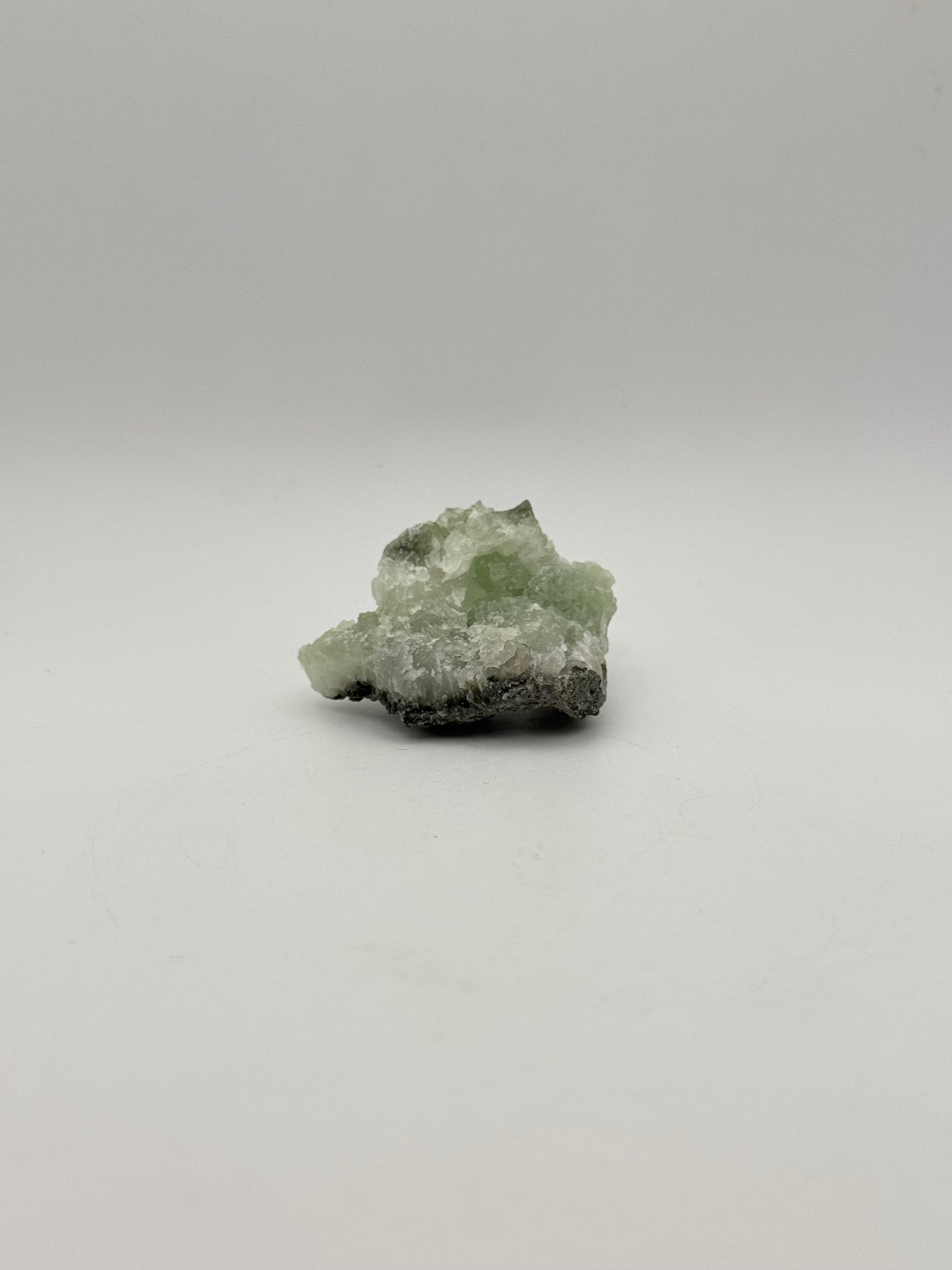 Raw prehnite specimen with amazing green color.