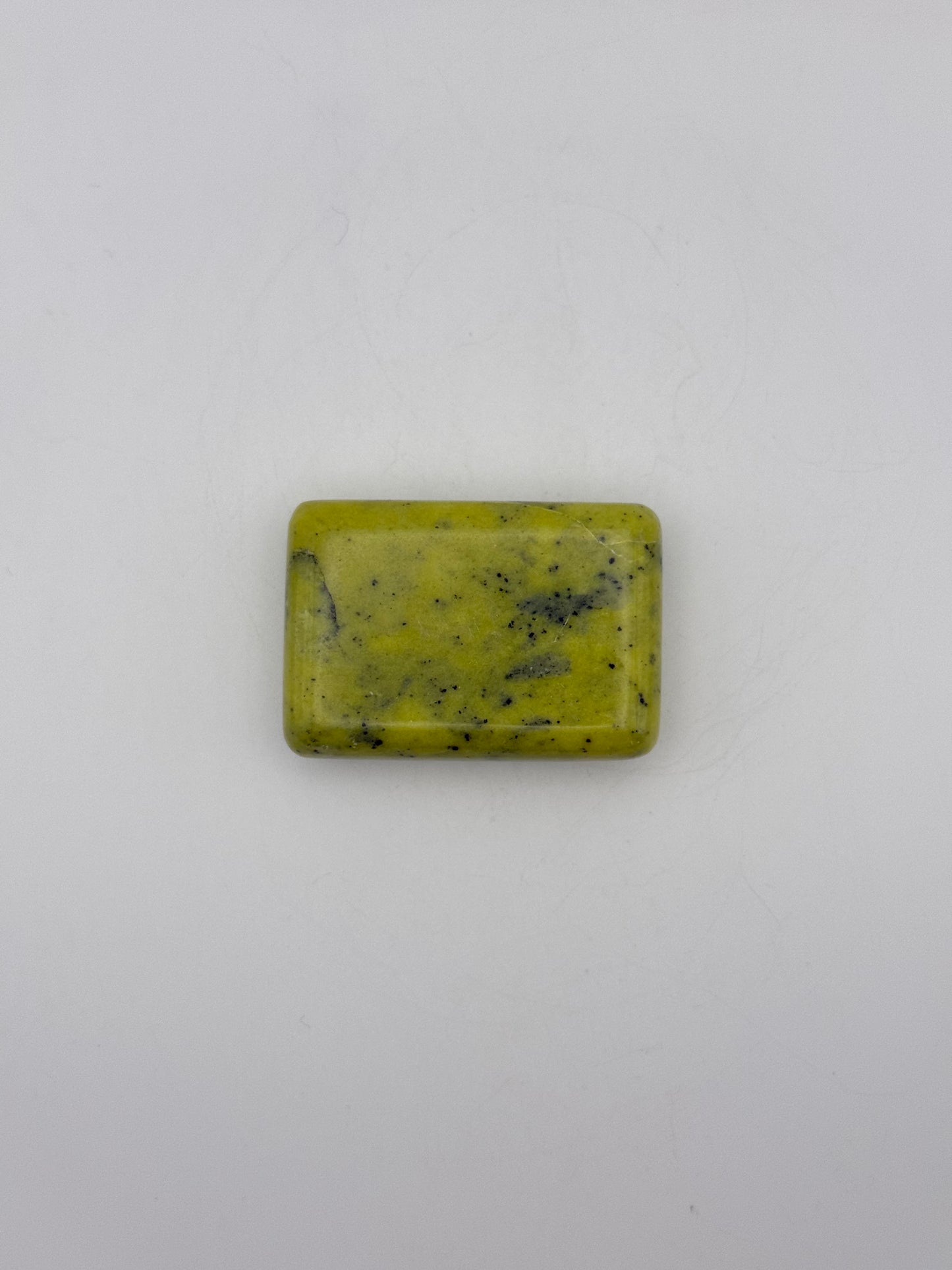 Polished healerite in the shape of a rectangular soap.