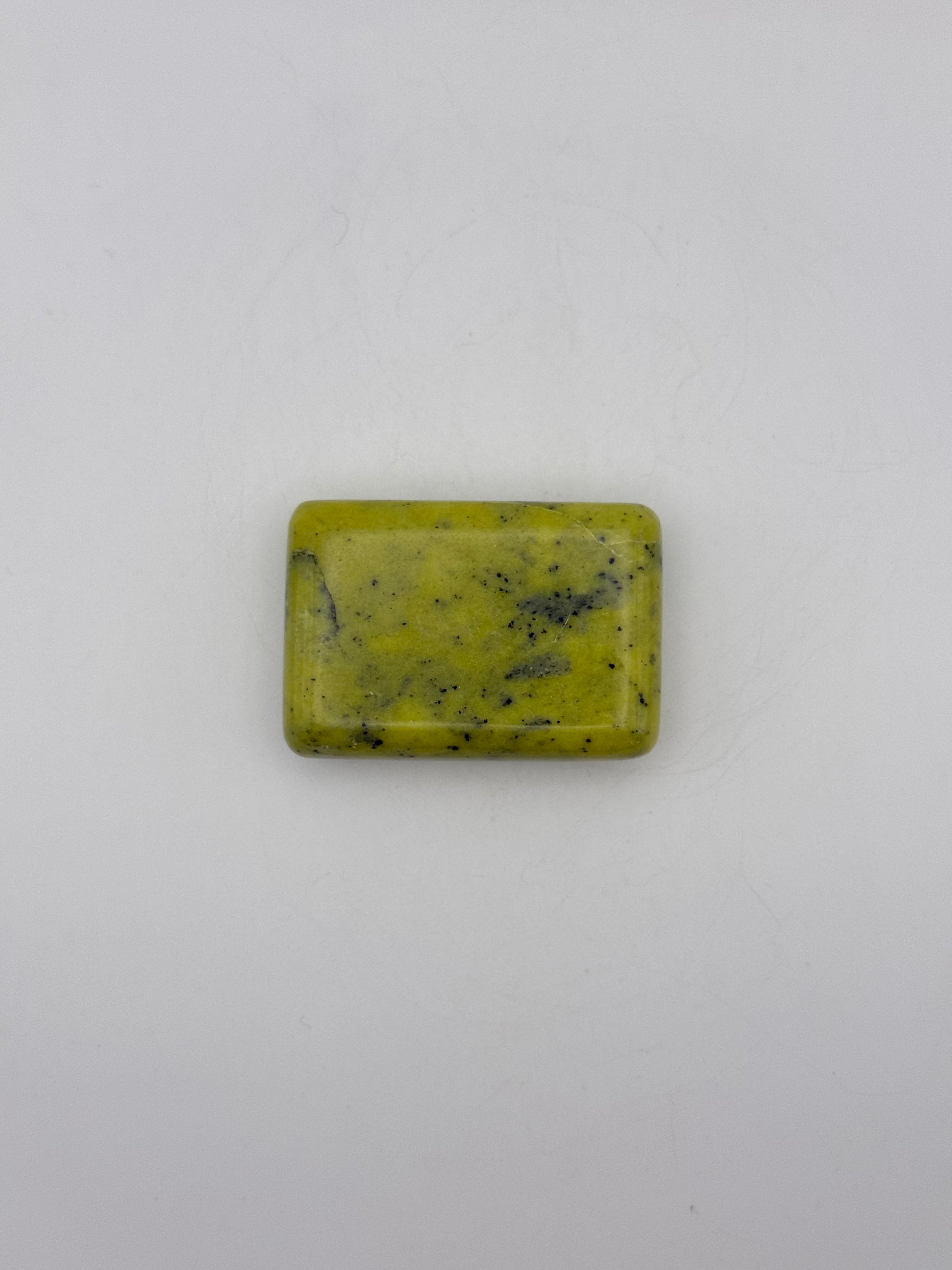 Polished healerite in the shape of a rectangular soap.