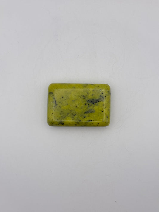 Polished healerite in the shape of a rectangular soap.