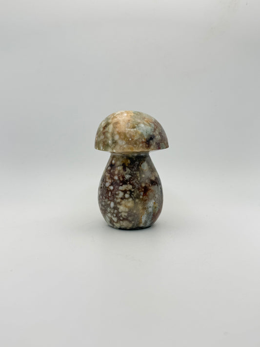 Ocean jasper stone in the shape of a mushroom.