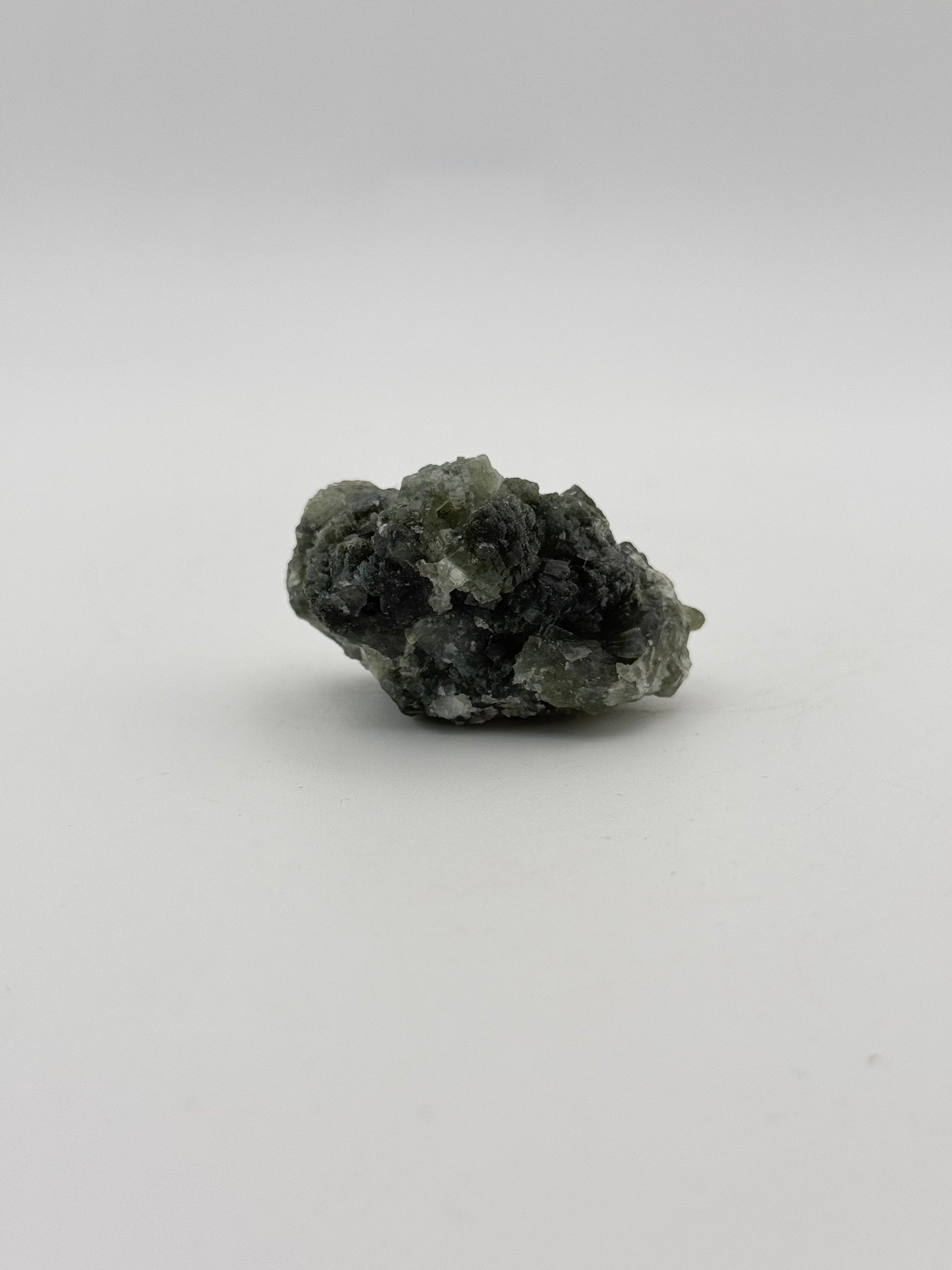 Raw Prehnite specimen with amazing green color.