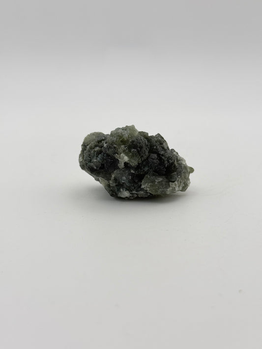 Raw Prehnite specimen with amazing green color.