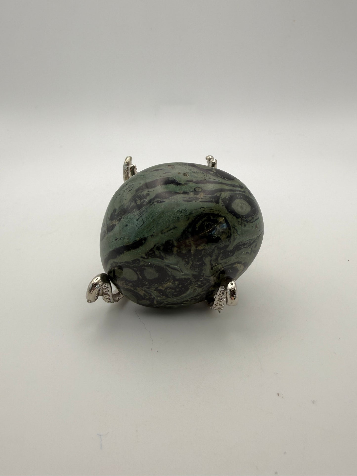 Polished kambaba jasper palm stone.