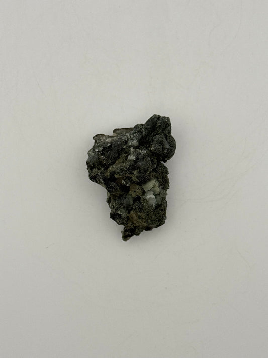 Raw prehnite specimen with amazing green color.